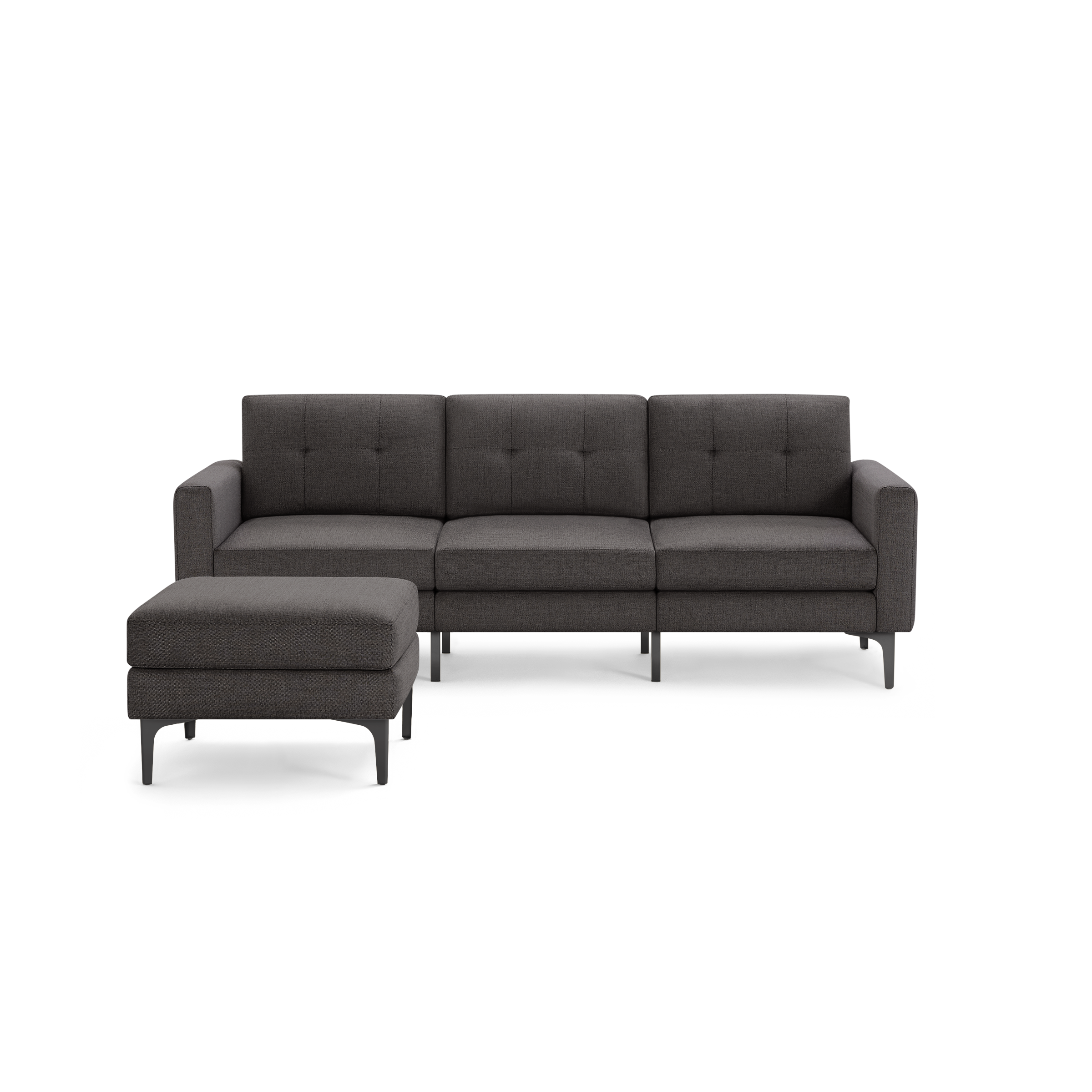 Modern dark gray upholstered sectional sofa with tufted back cushions and matching ottoman on slim metal legs.