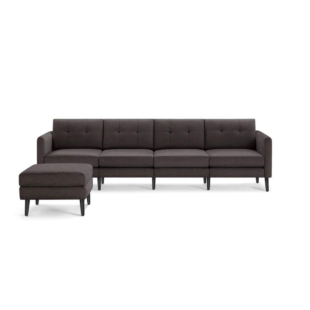 Dark gray modern sectional sofa with tufted back cushions, straight arms, wooden legs, and matching ottoman.
