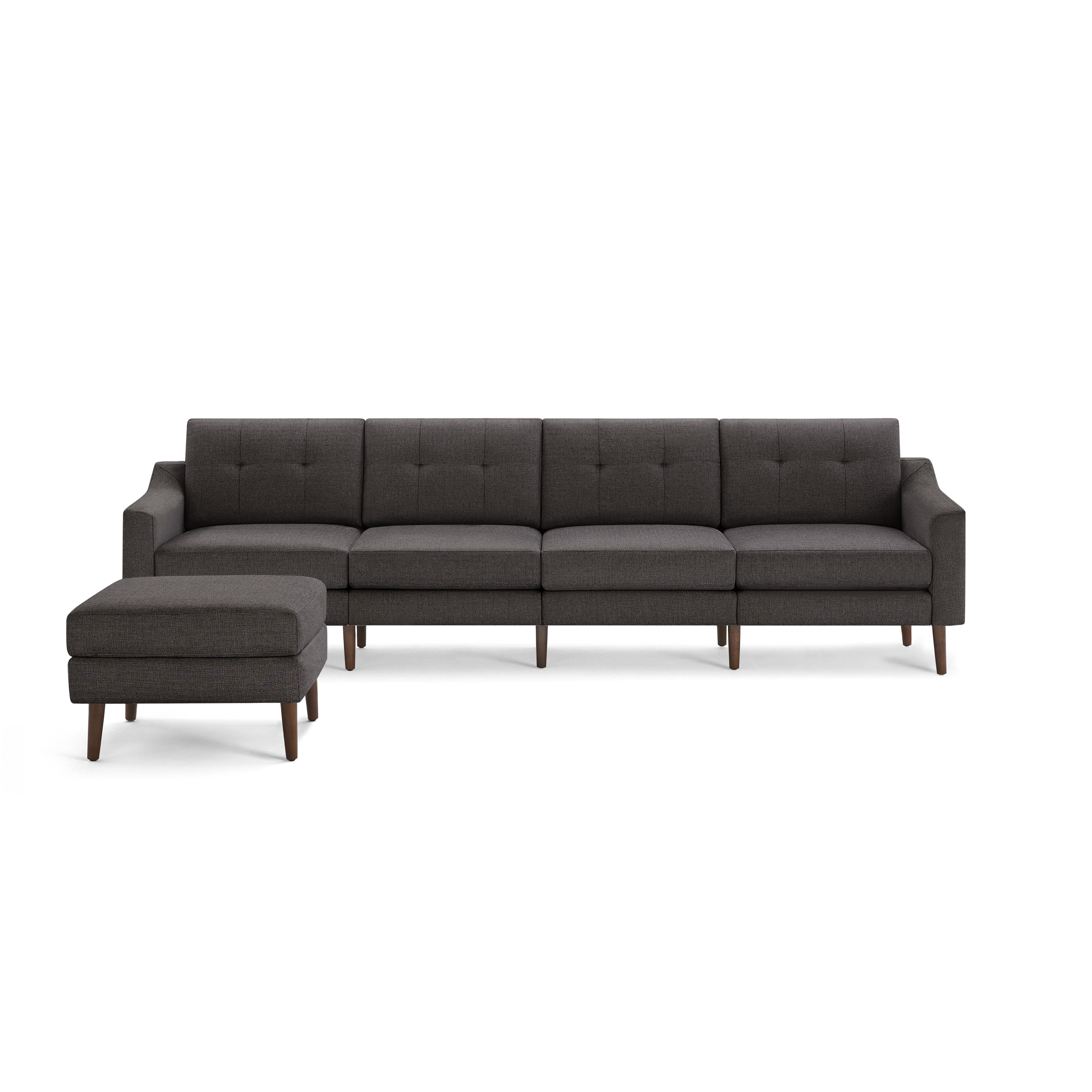 Dark gray fabric sectional sofa with tufted back cushions and wooden legs, paired with matching ottoman.