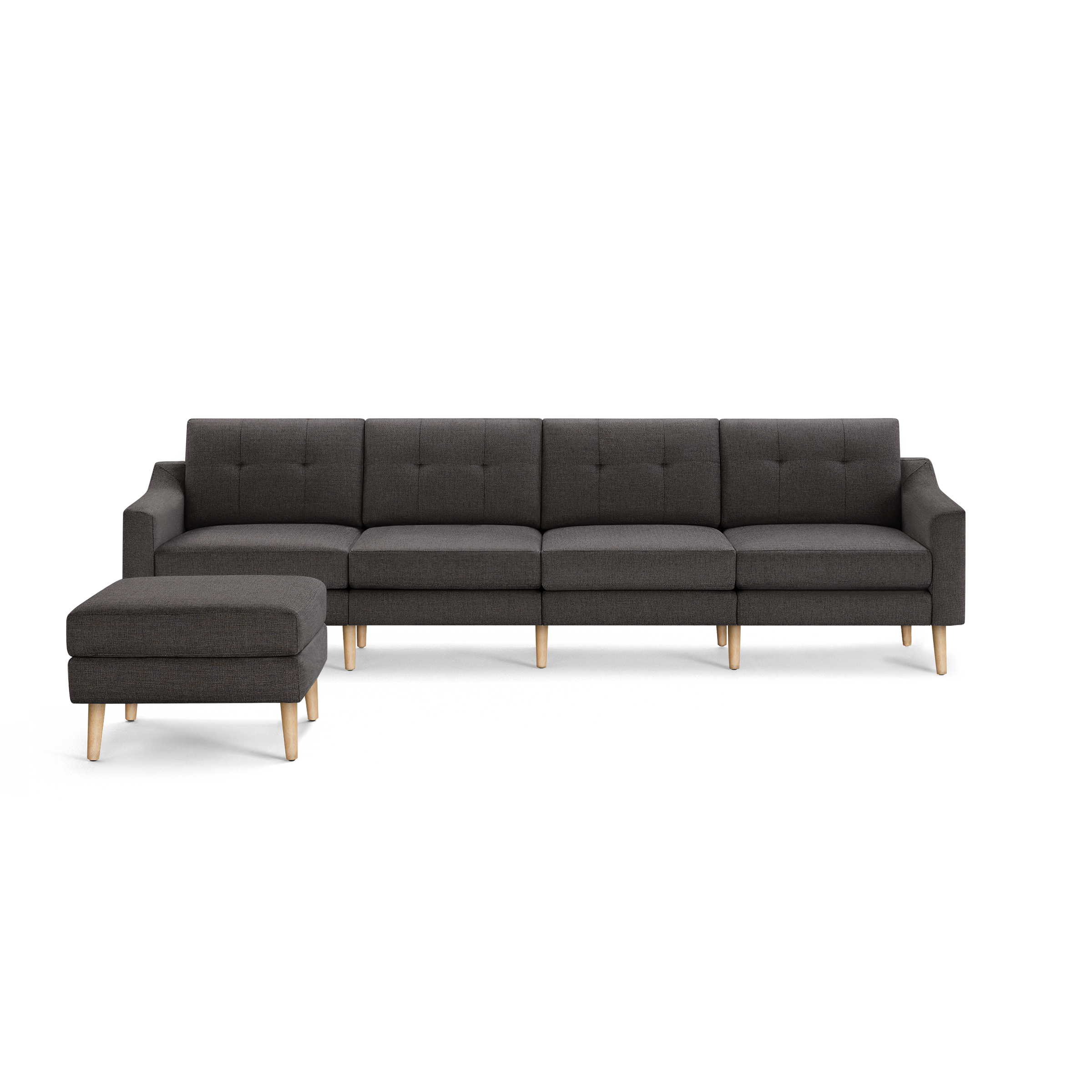 Dark gray fabric sectional sofa with tufted back cushions and light wooden legs, including a matching ottoman.
