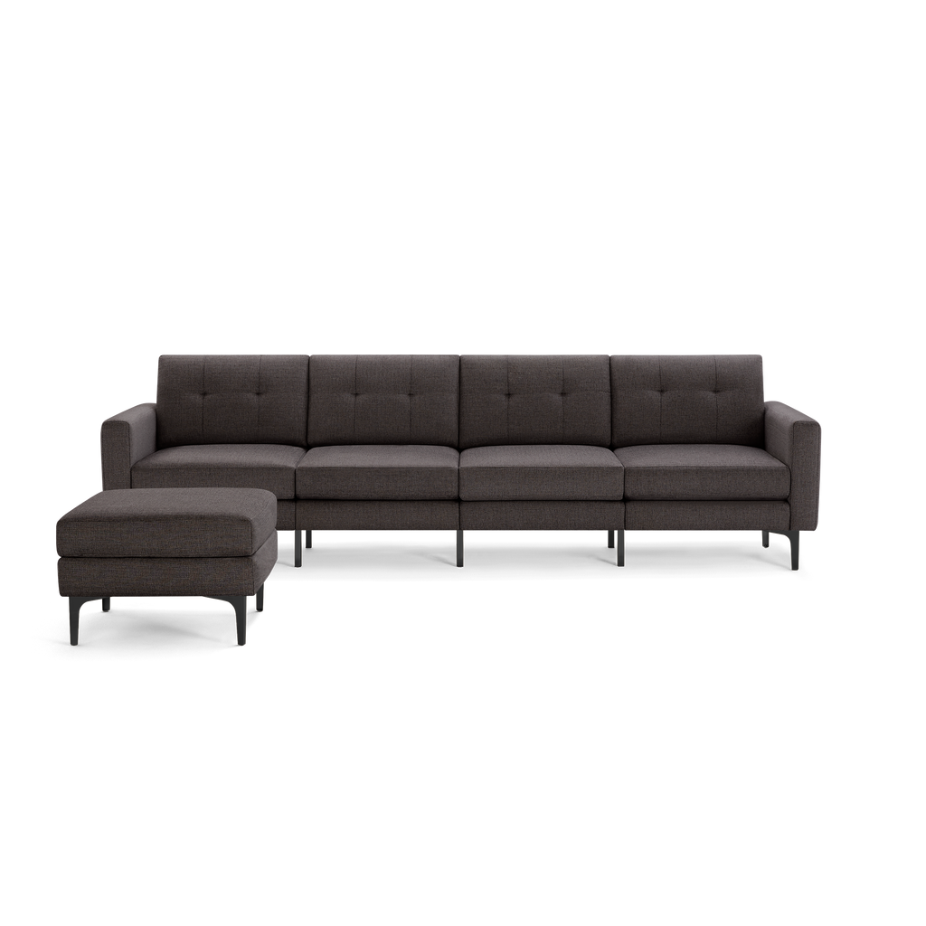 Dark gray modern sectional sofa with tufted cushions and metal legs, including a matching ottoman on the left side.