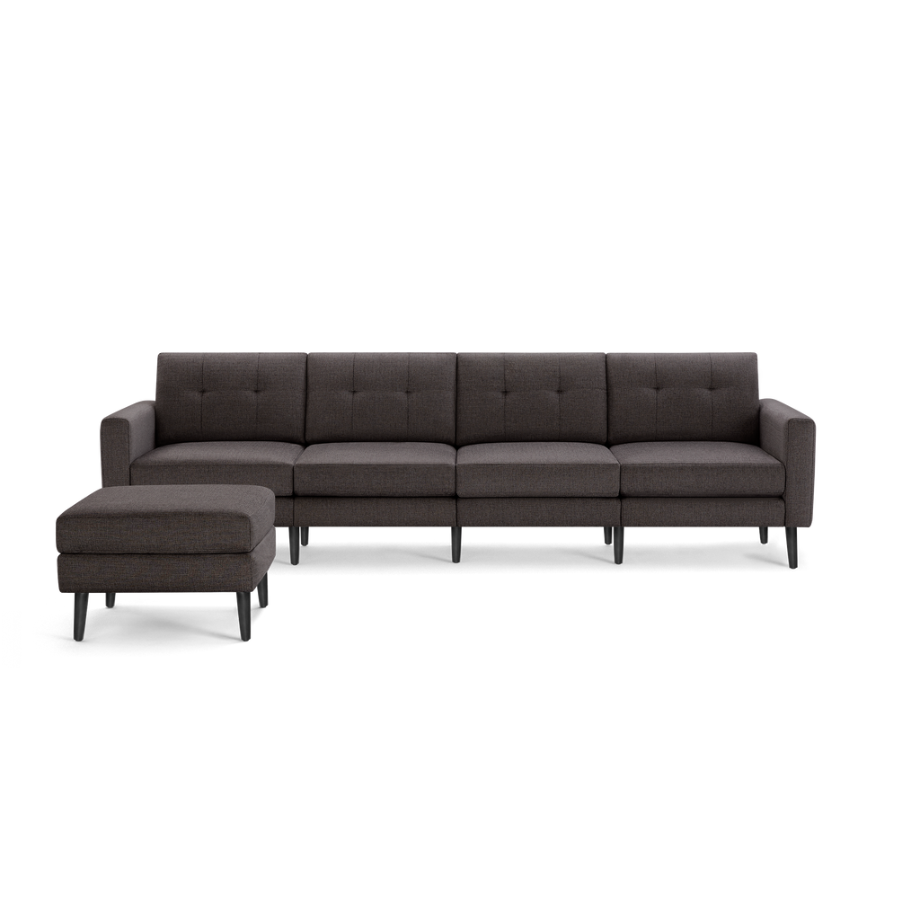 Four-seater dark brown fabric sectional sofa with tufted cushions and a matching ottoman, featuring black tapered legs.