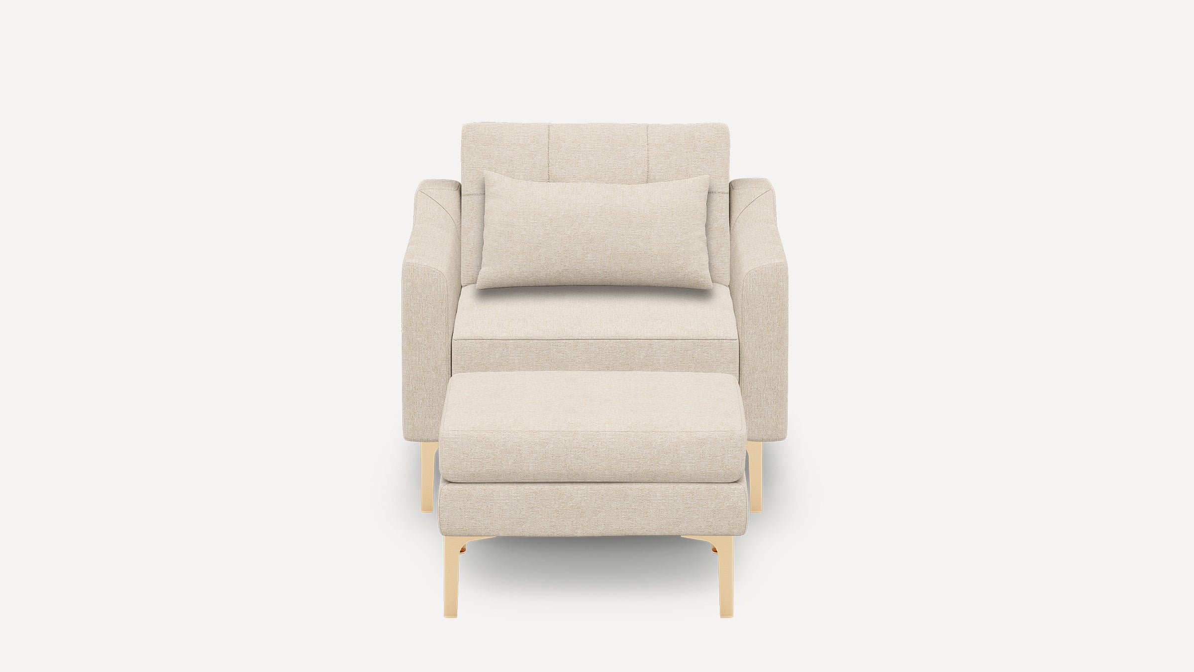 Modern beige fabric armchair with matching cushioned ottoman and rectangular lumbar pillow, supported by light wooden legs.