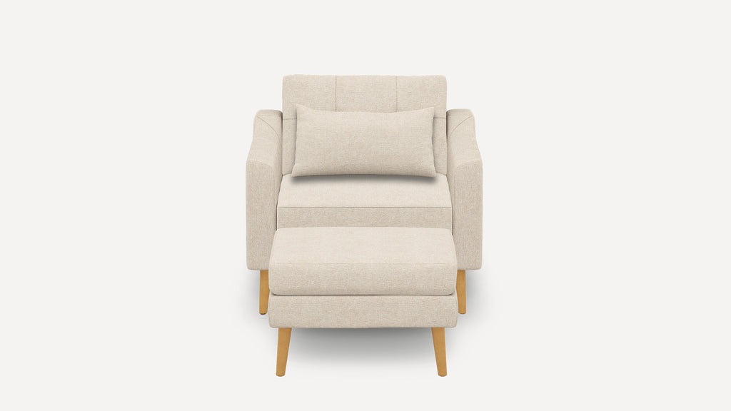 Front view of a beige upholstered armchair with a matching rectangular pillow and wooden legs on a white background.