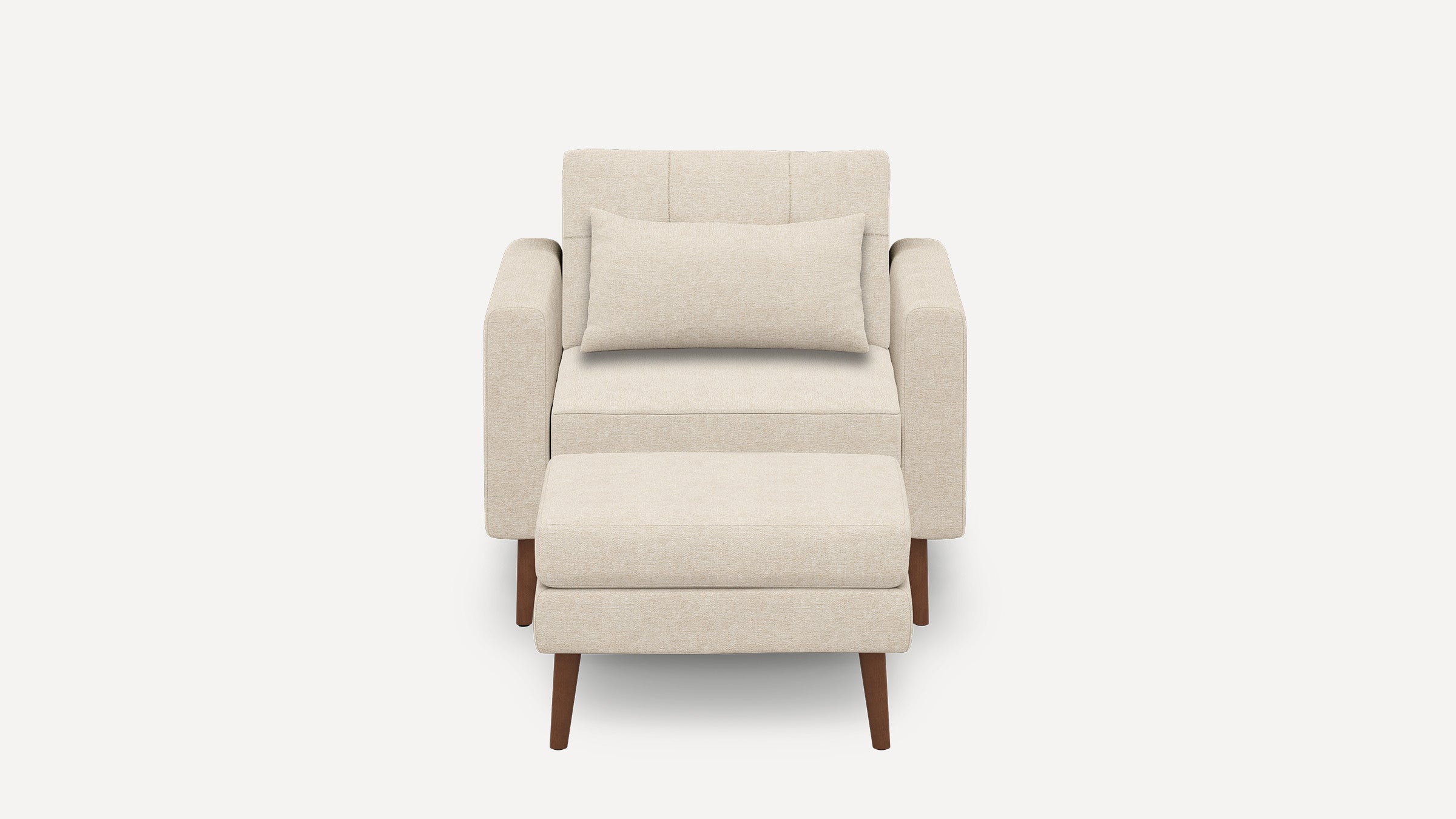 Beige upholstered armchair with matching ottoman and rectangular lumbar pillow, featuring wooden legs and clean, modern design.