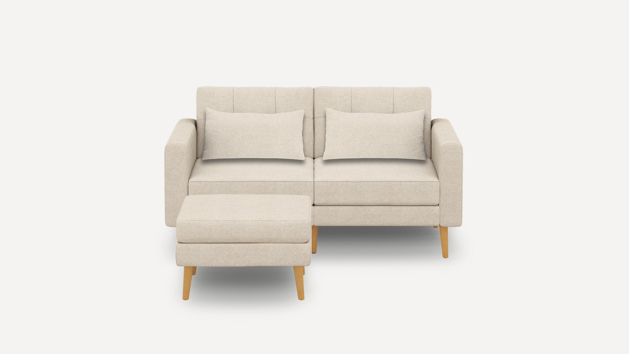 Beige modern loveseat sofa with two rectangular cushions and matching ottoman, supported by light wooden legs.