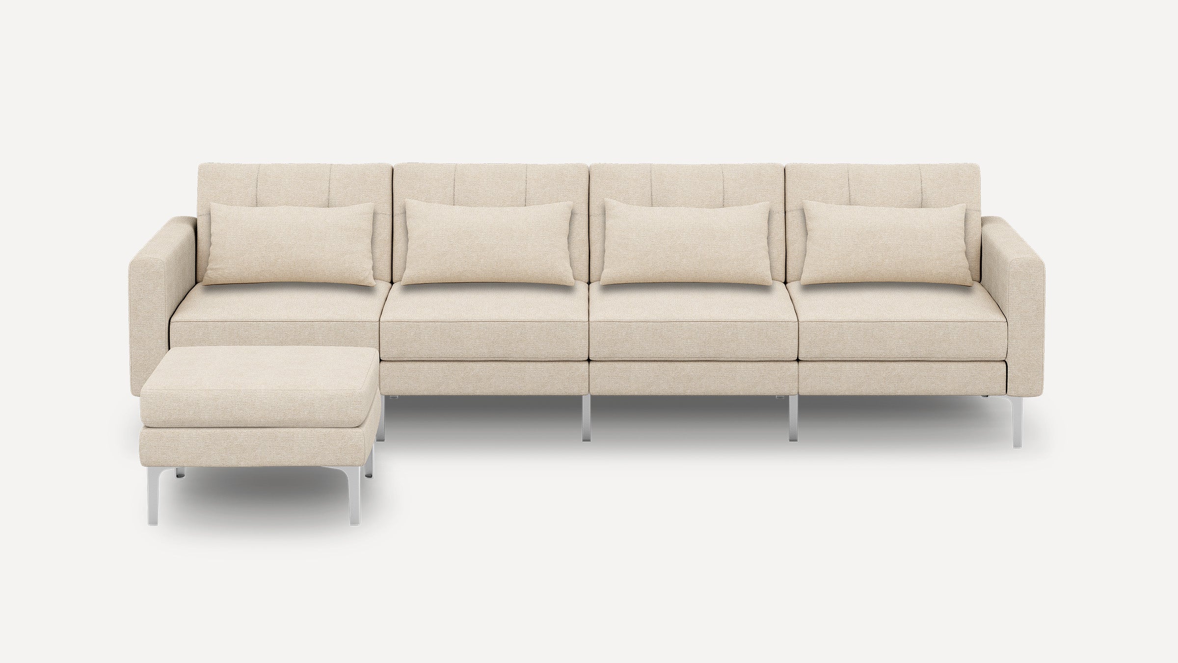 Beige modern sectional sofa with metal legs, four rectangular pillows, and a matching ottoman on a white background.
