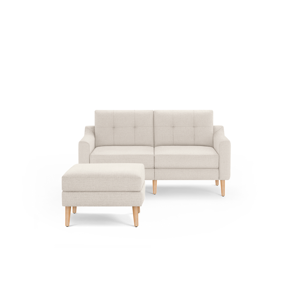 Light beige modern loveseat sofa with tufted backrest and separate ottoman, featuring wooden legs.