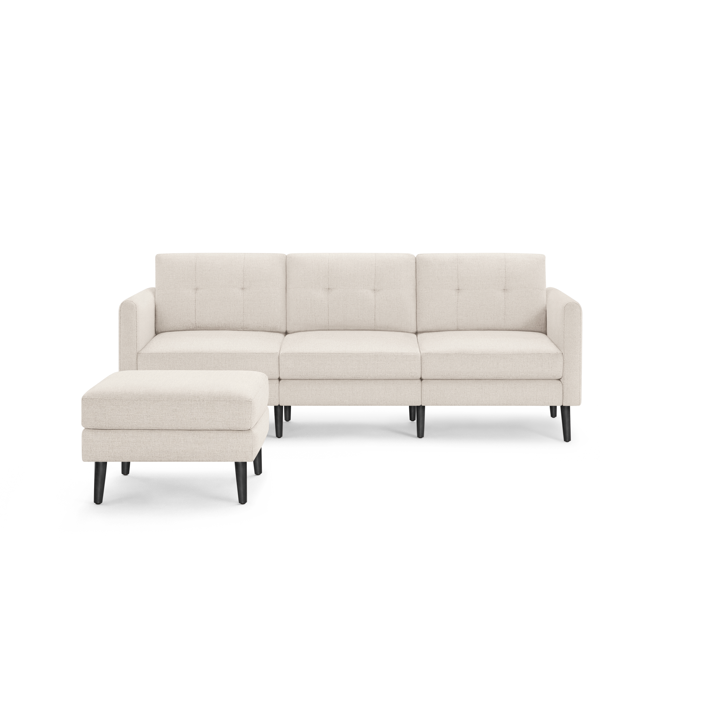 Cream-colored modern sectional sofa with tufted cushions and matching ottoman, featuring black tapered wooden legs.