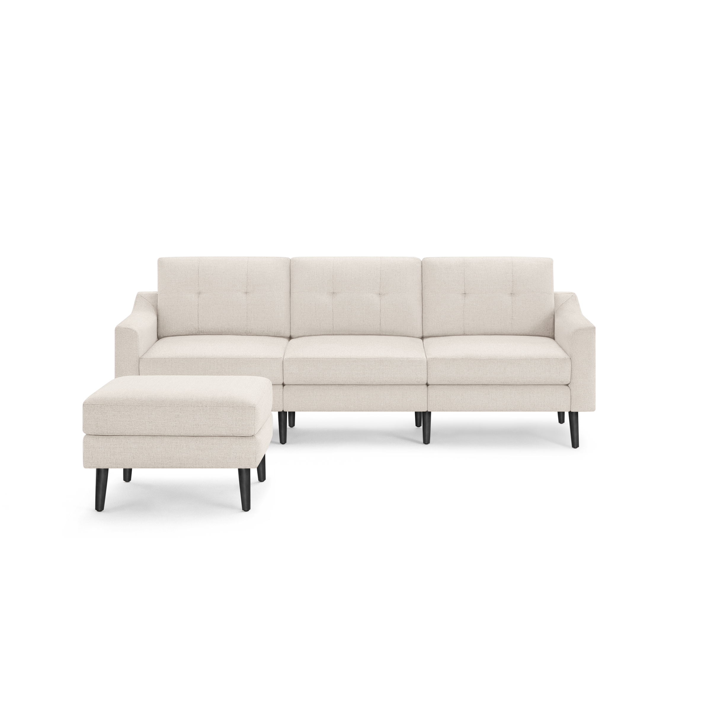 Beige L-shaped sectional sofa with tufted back cushions, matching ottoman, and black tapered wooden legs.