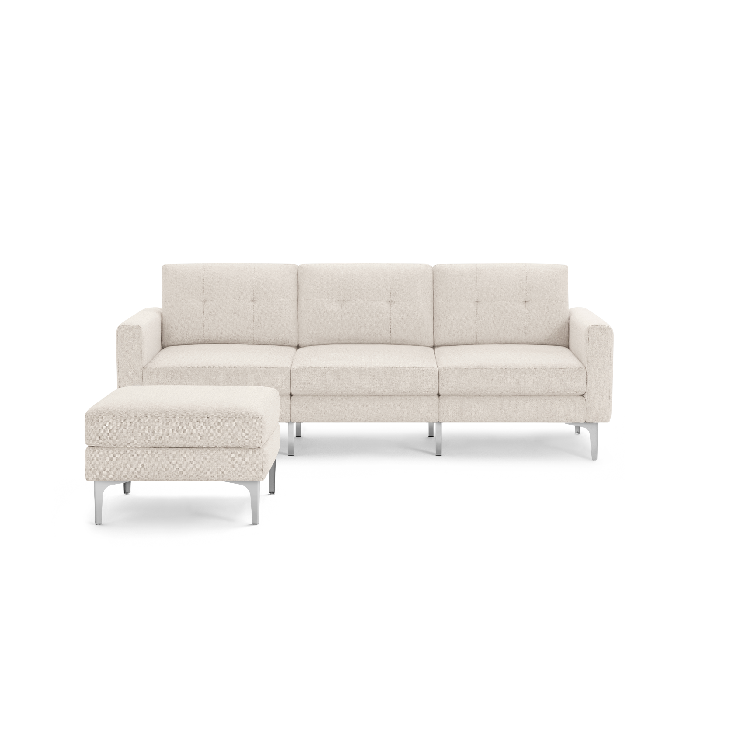 Cream-colored modern sectional sofa with tufted back cushions and matching ottoman, supported by sleek metal legs.
