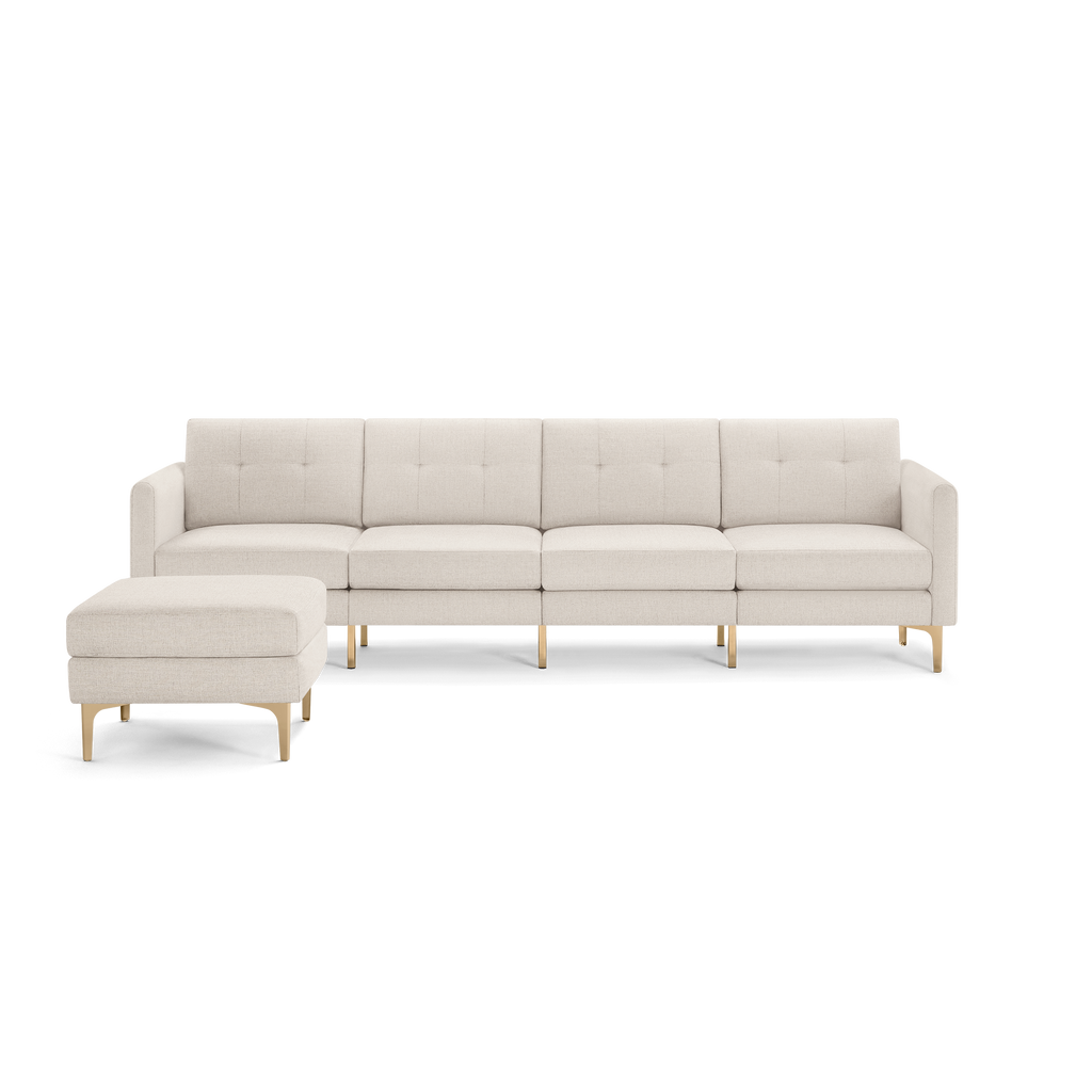Light beige sectional sofa with tufted back cushions, sleek armrests, and wooden legs, featuring a matching ottoman.