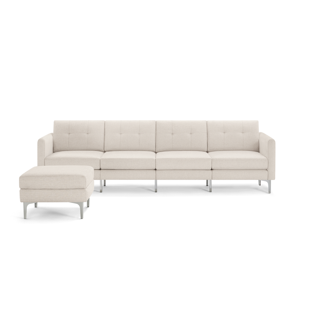 Modern beige fabric sectional sofa with tufted back cushions and a matching ottoman on sleek metal legs.