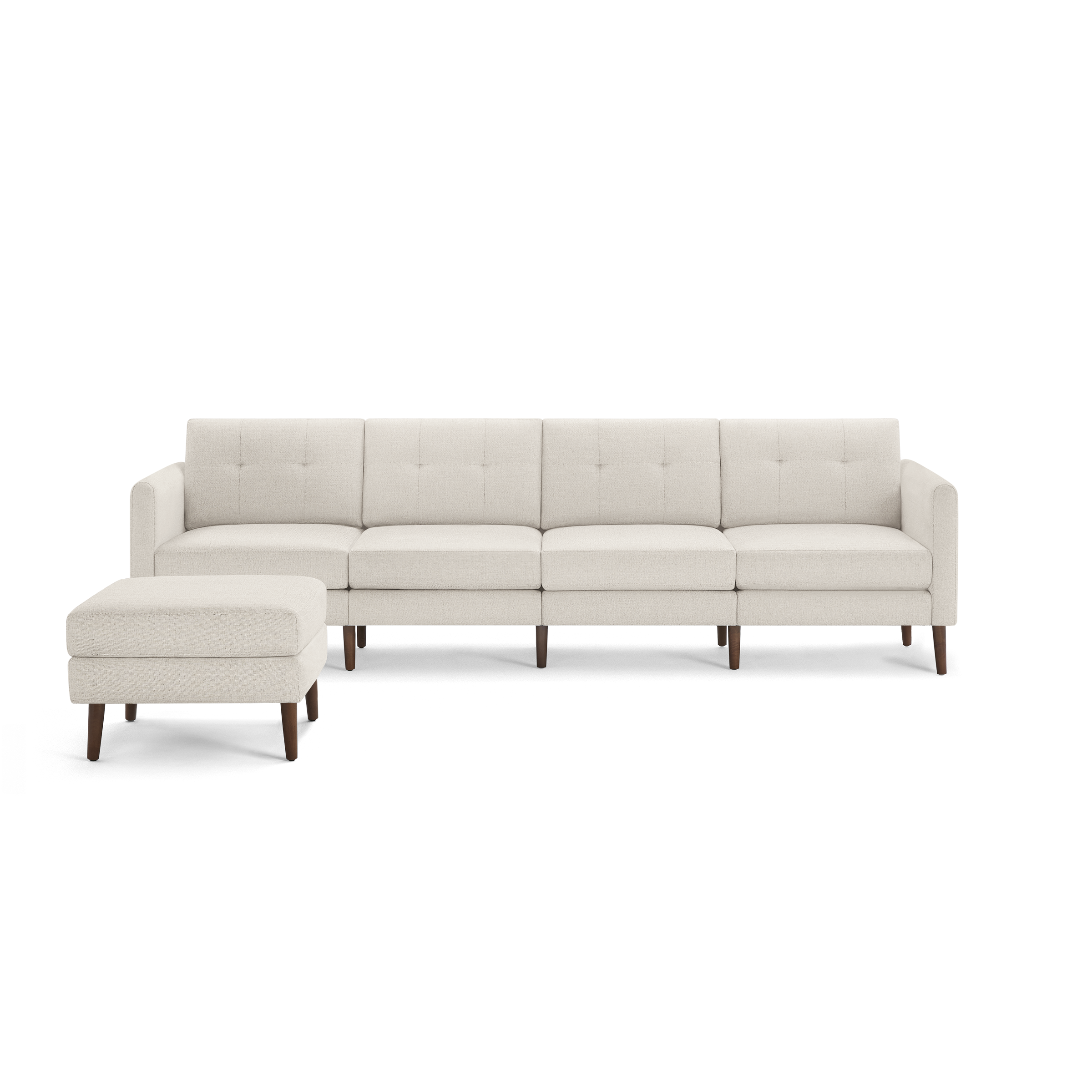 Beige upholstered sectional sofa with tufted back cushions and wooden legs, featuring a separate matching ottoman.