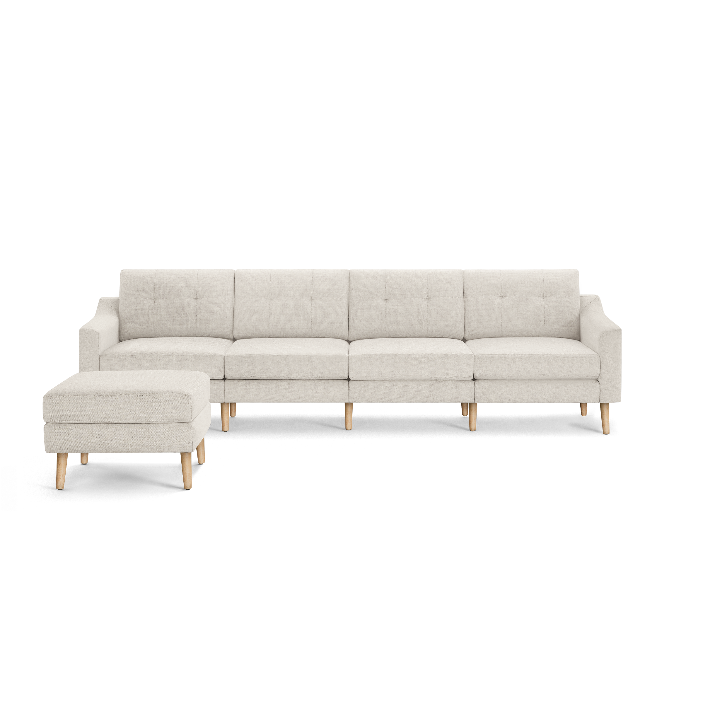 Beige L-shaped sectional sofa with tufted cushions and light wooden legs, including a matching ottoman on the left side.