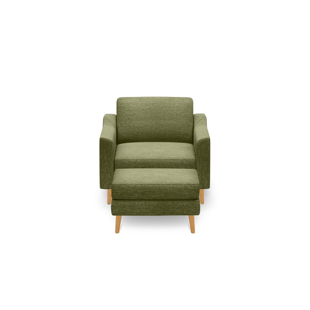 Green upholstered armchair with matching ottoman, wooden legs, and a modern, minimalist design, shown on a black background.