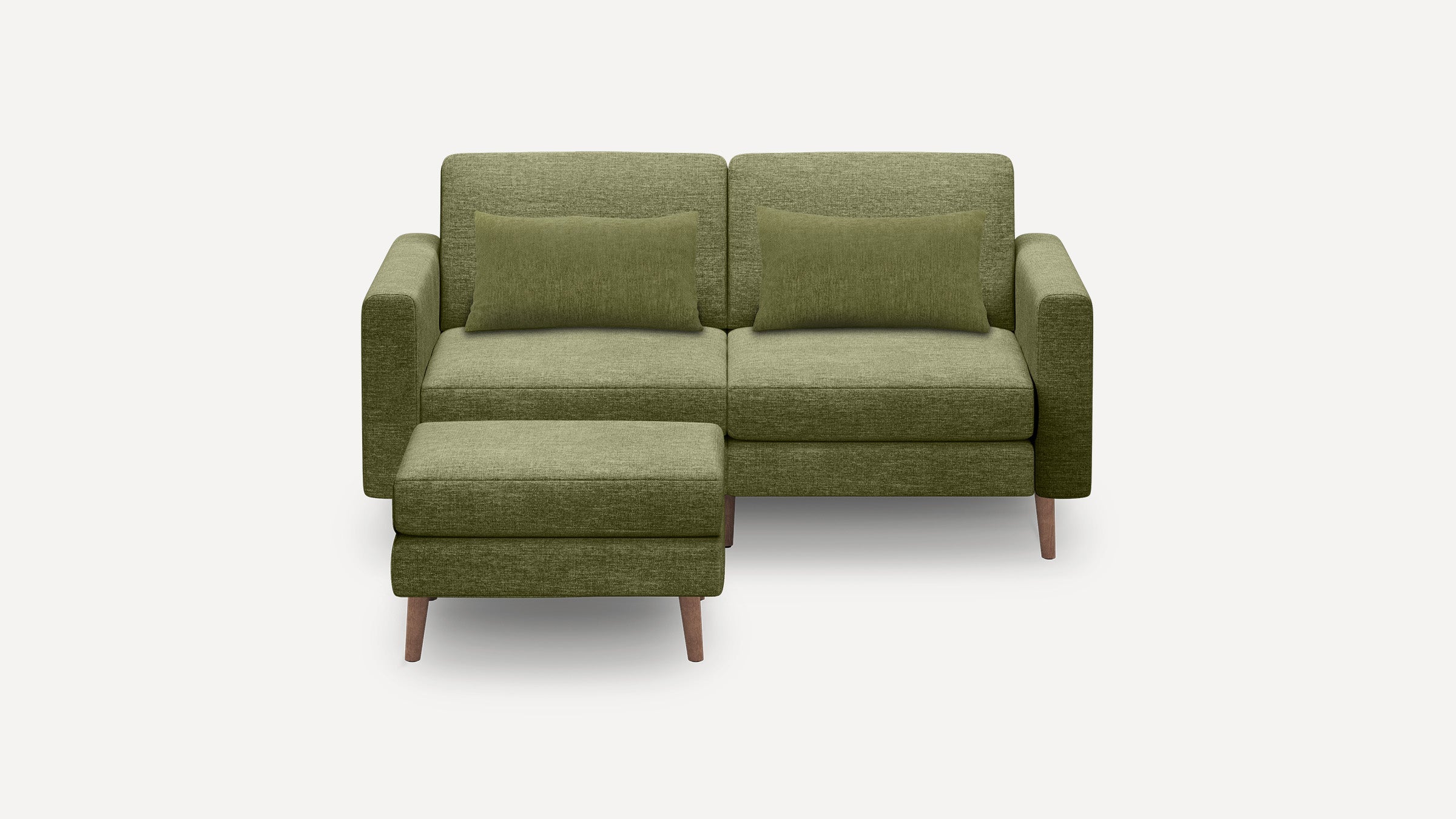 Green upholstered two-seater sofa with matching rectangular cushions and a left-side ottoman, featuring wooden legs.