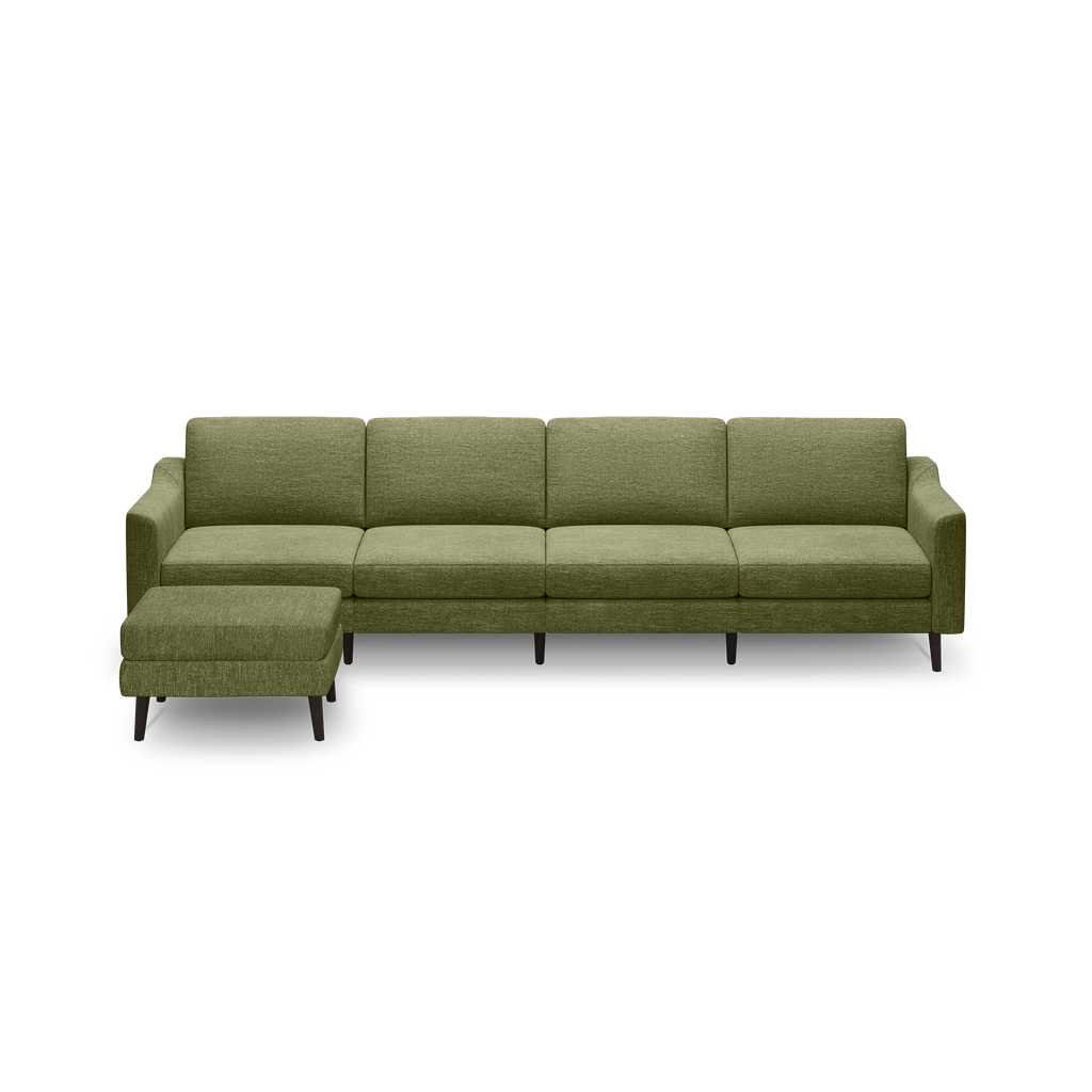 Green fabric sectional sofa with chaise lounge and dark wooden legs, designed for modern living rooms.