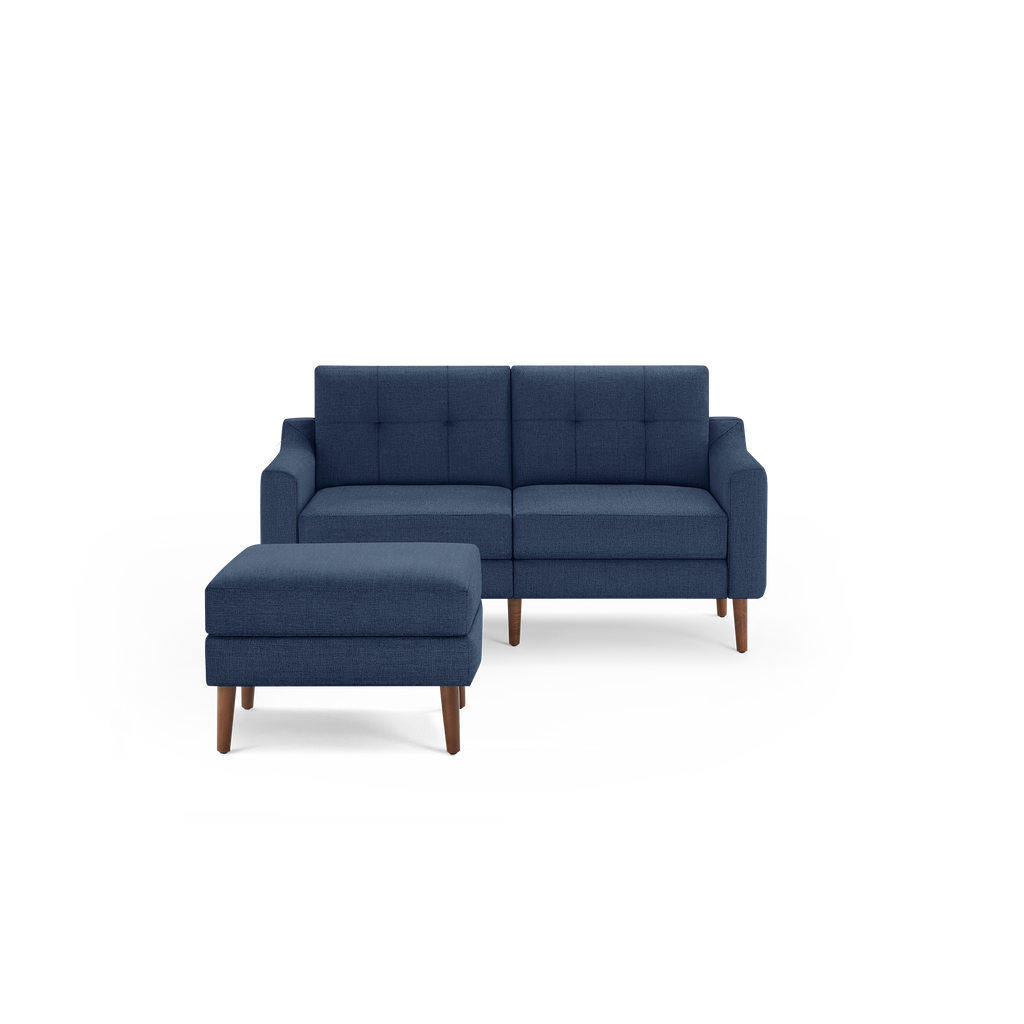 Blue modern loveseat with tufted back cushions and matching ottoman, featuring wooden legs and clean, straight armrests.