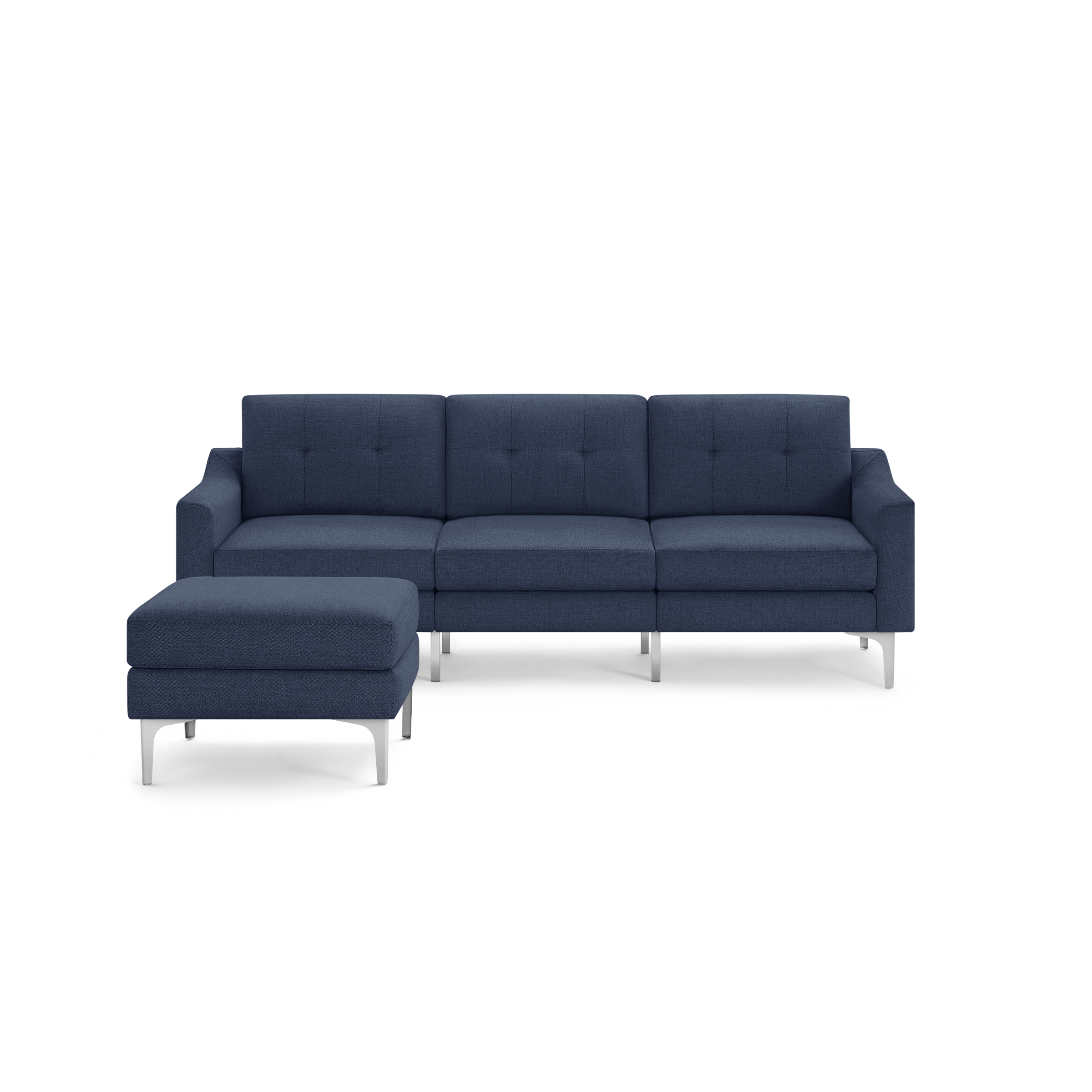 Modern navy blue fabric sectional sofa with tufted back cushions and chrome metal legs, including a matching ottoman.