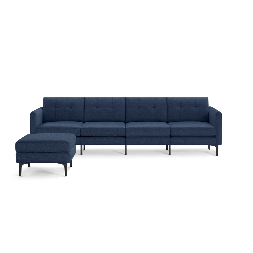 Modern navy blue sectional sofa with a chaise lounge, tufted cushions, and sleek black metal legs.