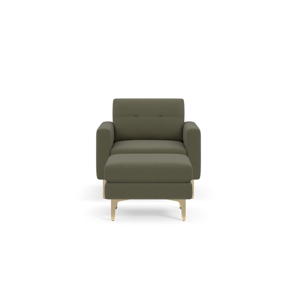 Modern armchair with Moss green fabric upholstery, cushioned seat and backrest, straight armrests, and light wooden legs.