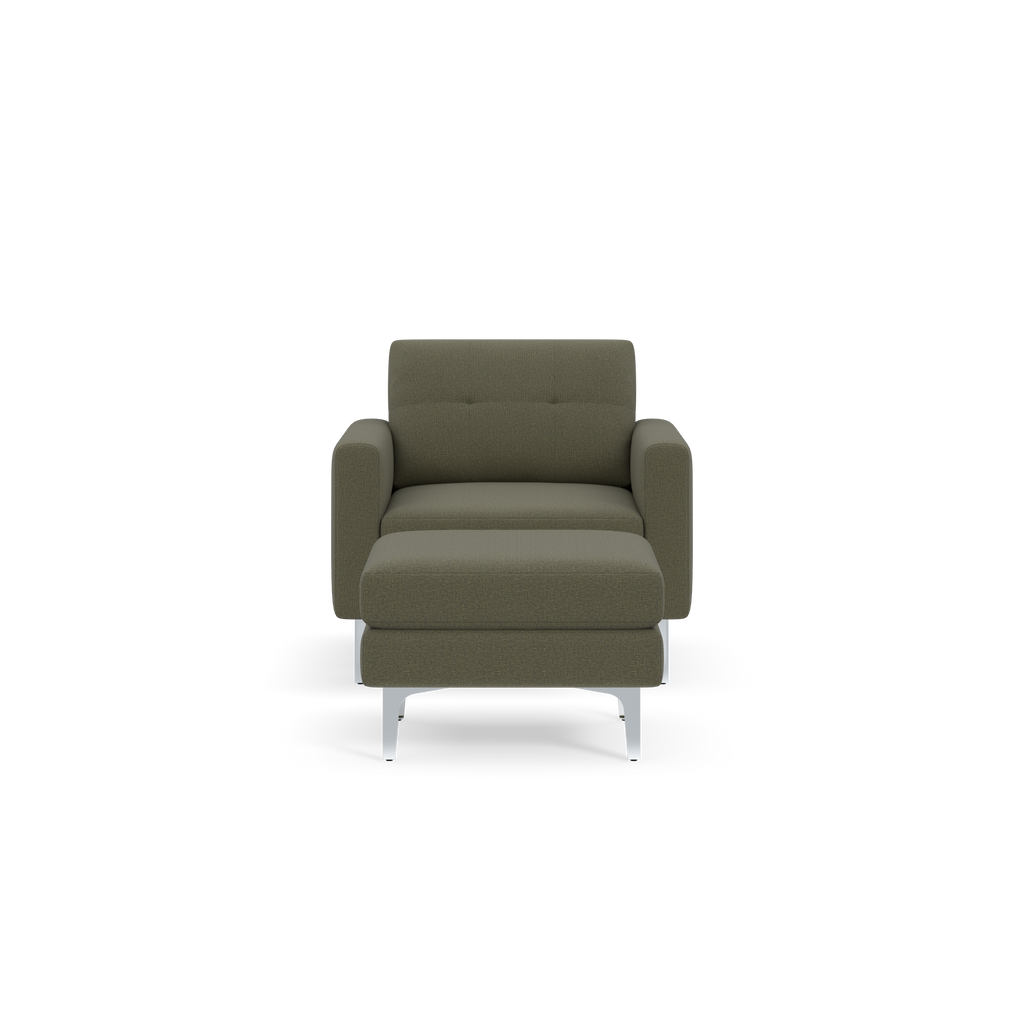 Modern Moss green fabric armchair with a matching ottoman, metal legs, and contemporary design, shown against a black background.