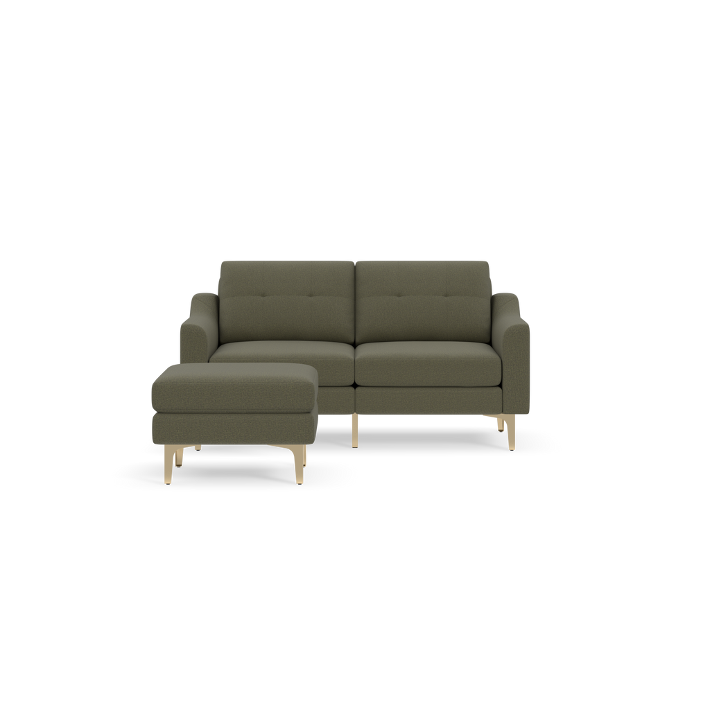 Modern Moss green fabric loveseat with matching ottoman and light wooden legs, shown on a black background.