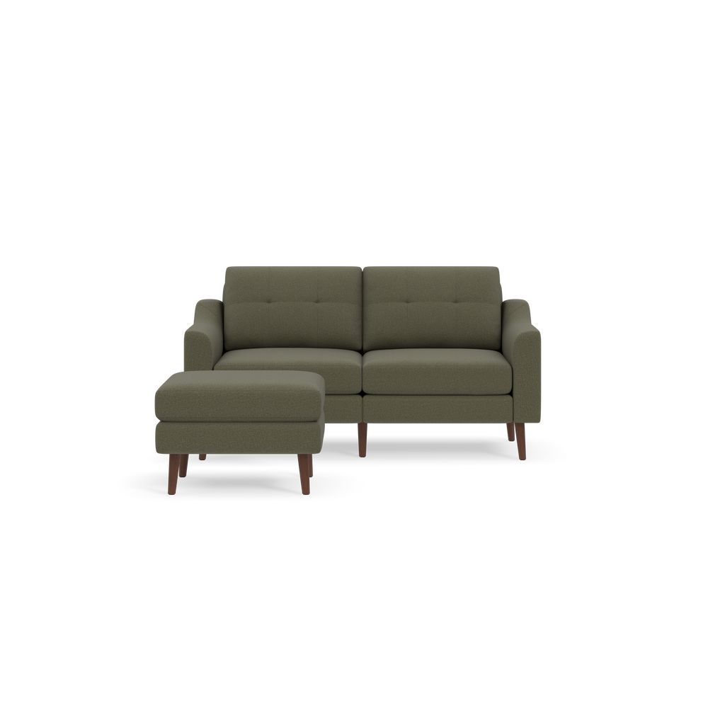 Modern Moss green fabric loveseat sofa with wooden legs and matching ottoman on black background.