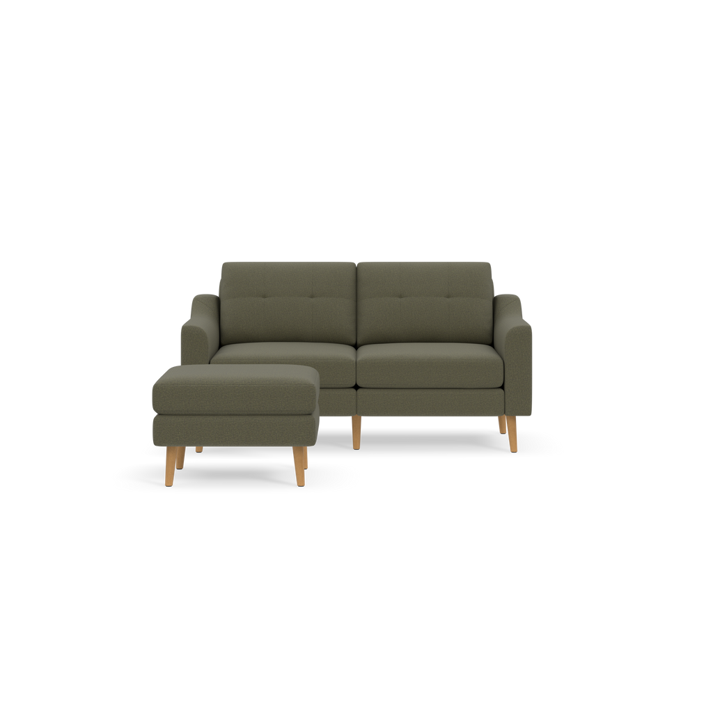 Moss green two-seater sofa with matching ottoman, wooden legs, and tufted back cushions, modern minimalist design.