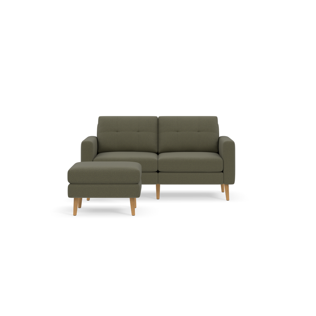 Modern Moss green fabric loveseat with tufted back cushions and a matching ottoman on wooden legs.