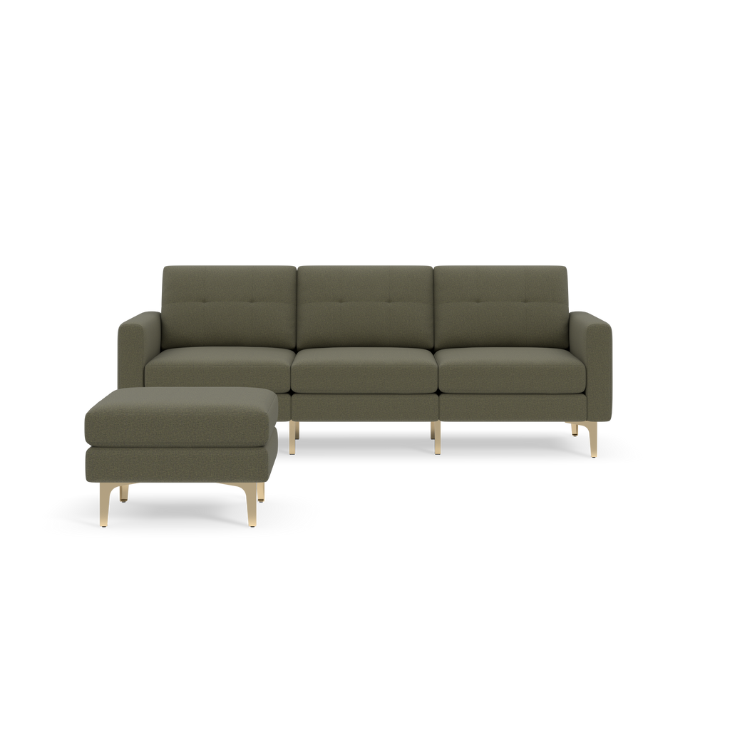 Modern Moss green sectional sofa with chaise lounge, tufted cushions, and light wooden legs on a black background.