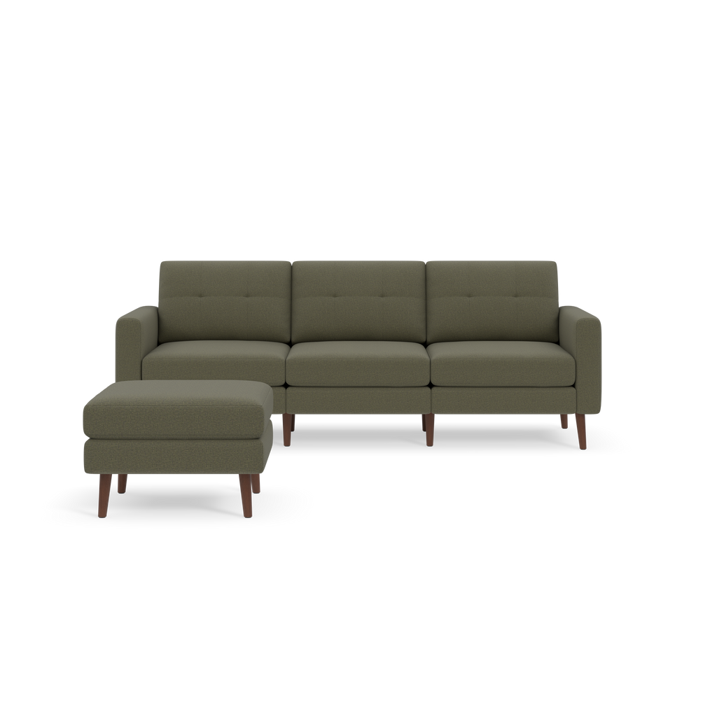Moss green three-seater sectional sofa with matching ottoman, featuring wooden legs and tufted back cushions.