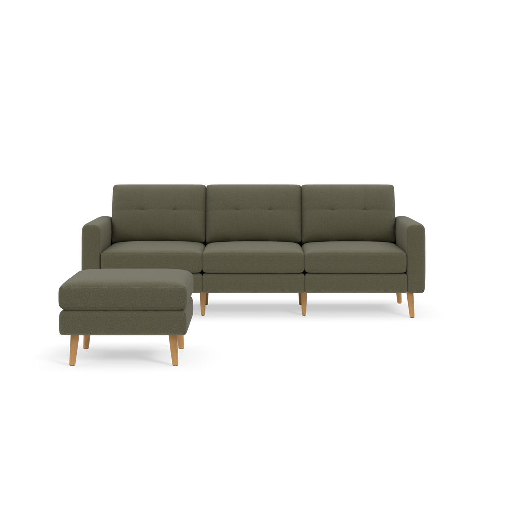 Modern Moss green sectional sofa with tufted cushions and wooden legs, paired with a matching ottoman, isolated on black background.