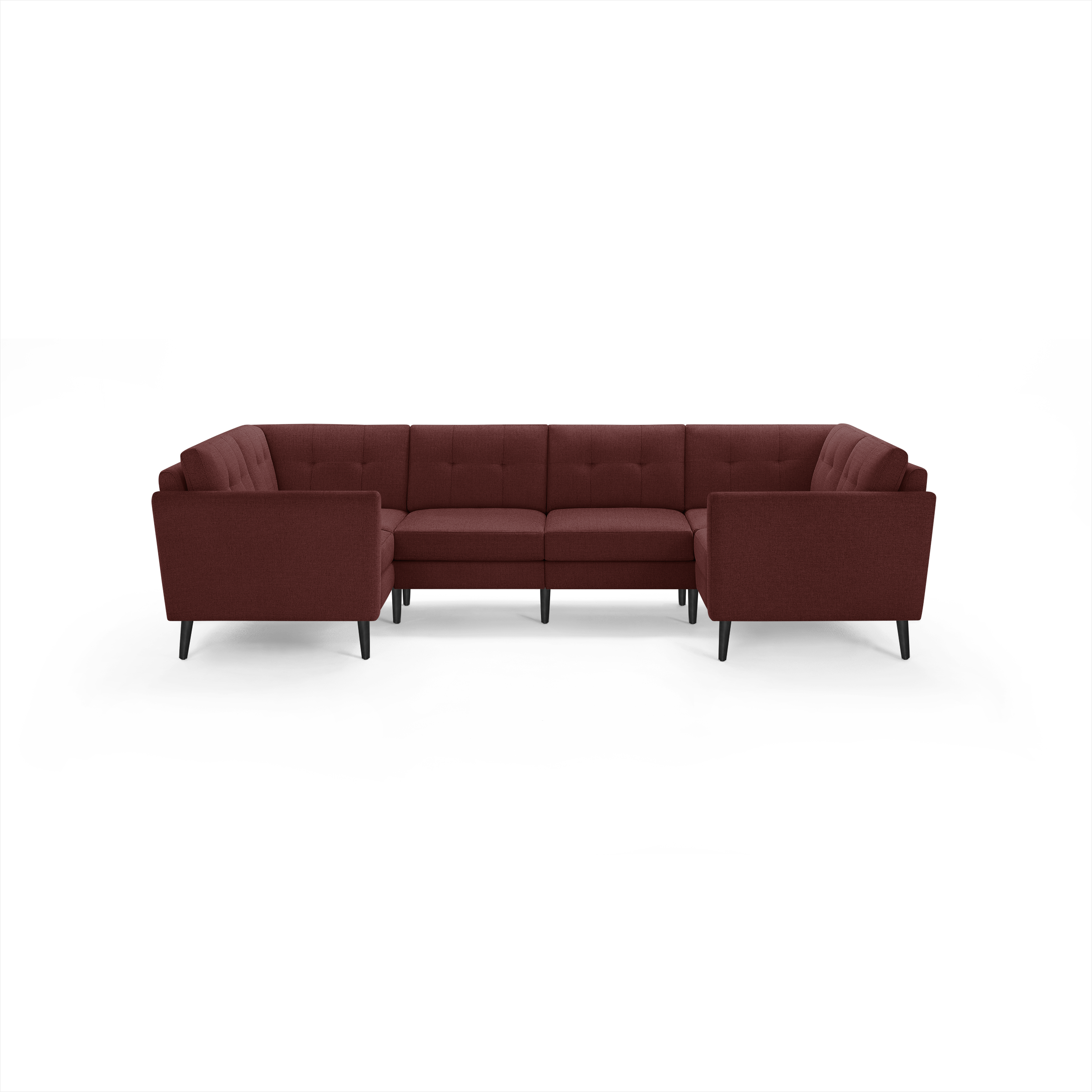 Large modern U-shaped sectional sofa in dark red fabric with tufted cushions and black tapered legs, designed for spacious living rooms.
