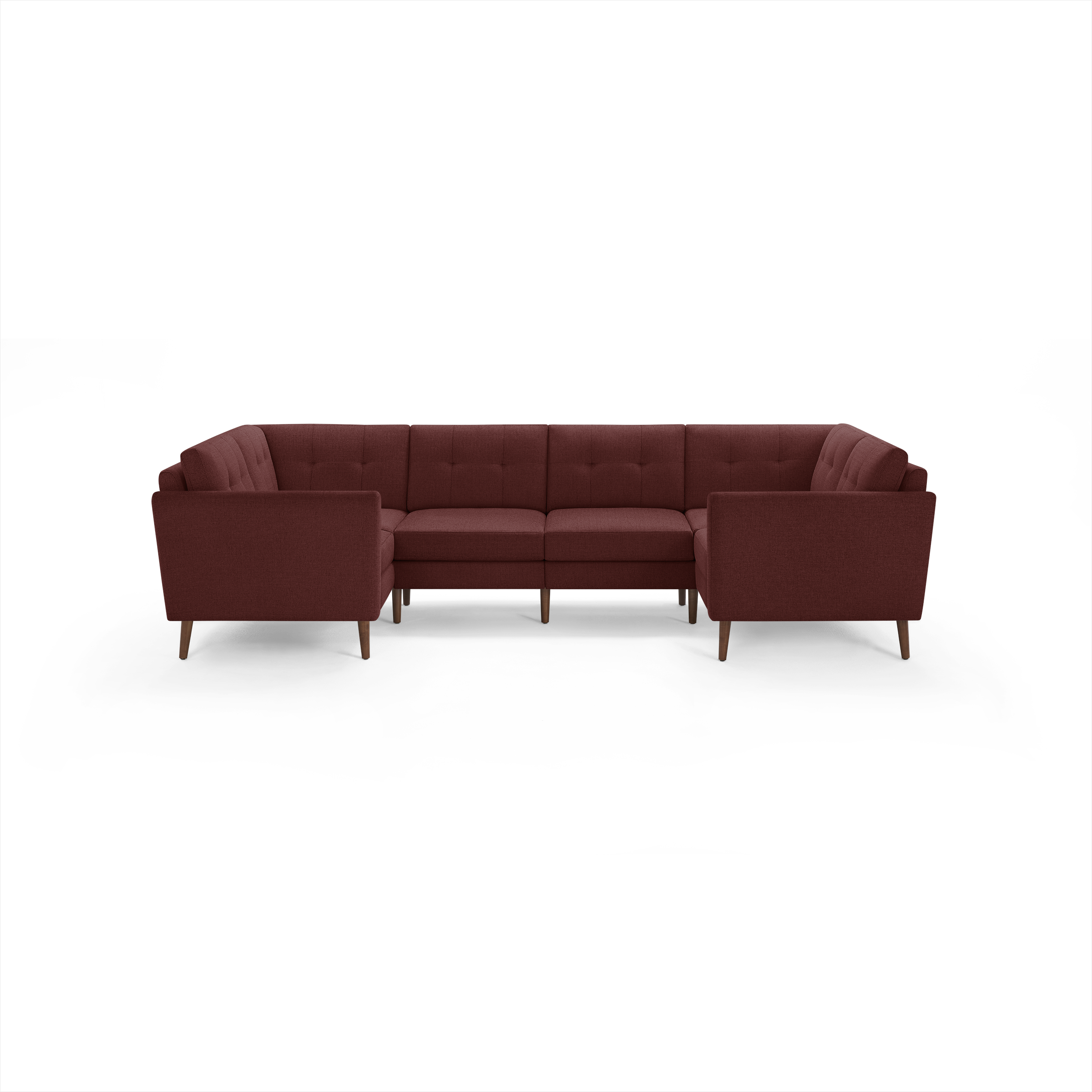 Modern U-shaped sectional sofa in deep red fabric with tufted back cushions and wooden legs, suitable for spacious living rooms.