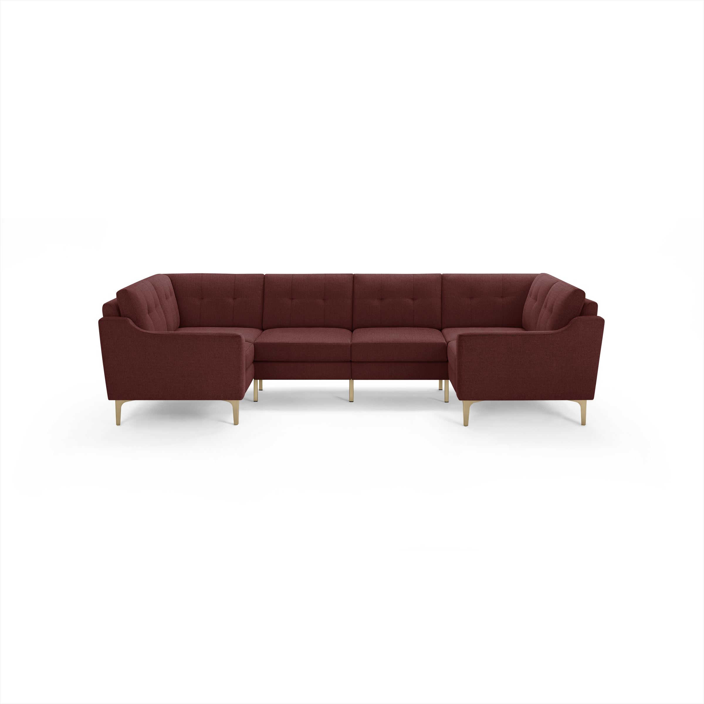Large L-shaped sectional sofa in deep burgundy fabric with tufted back cushions and light wooden legs.