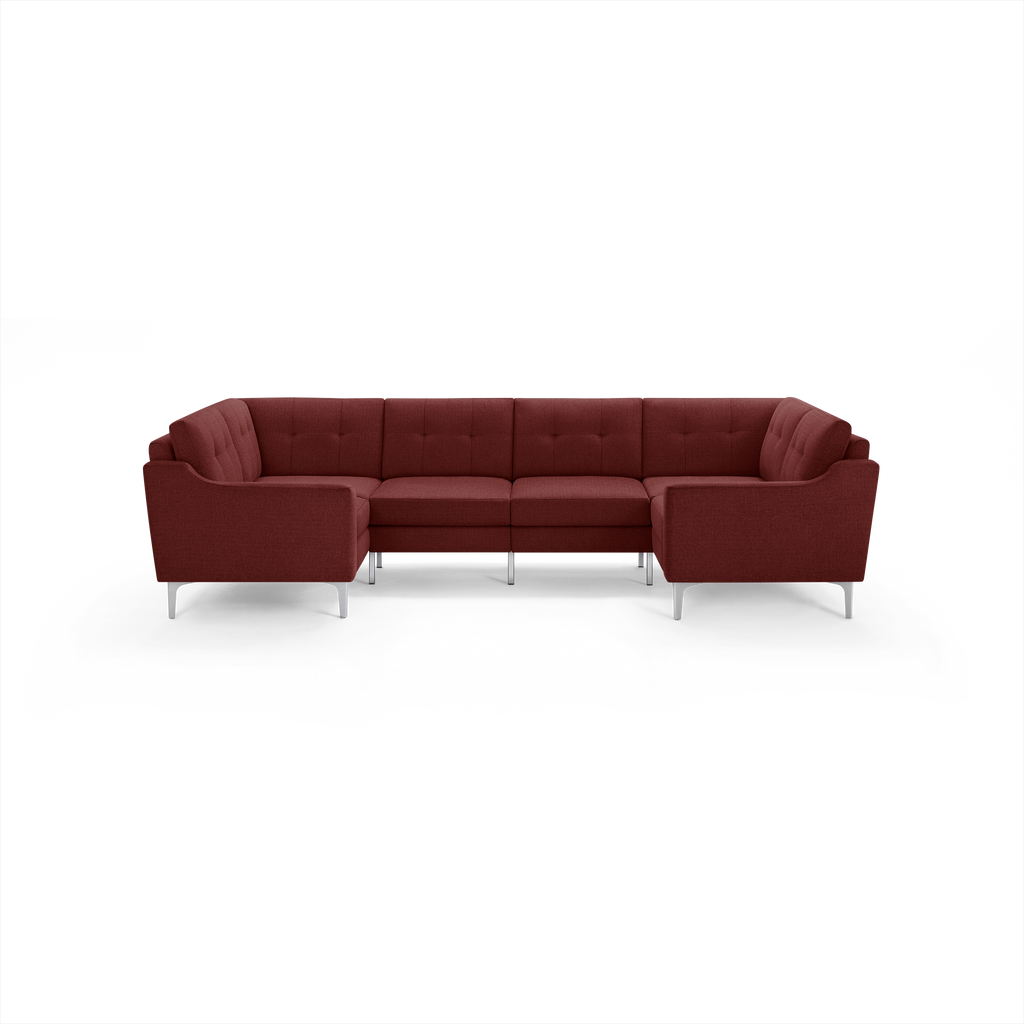 Modern deep red fabric sectional sofa with tufted cushions and sleek silver metal legs, designed for spacious living rooms.