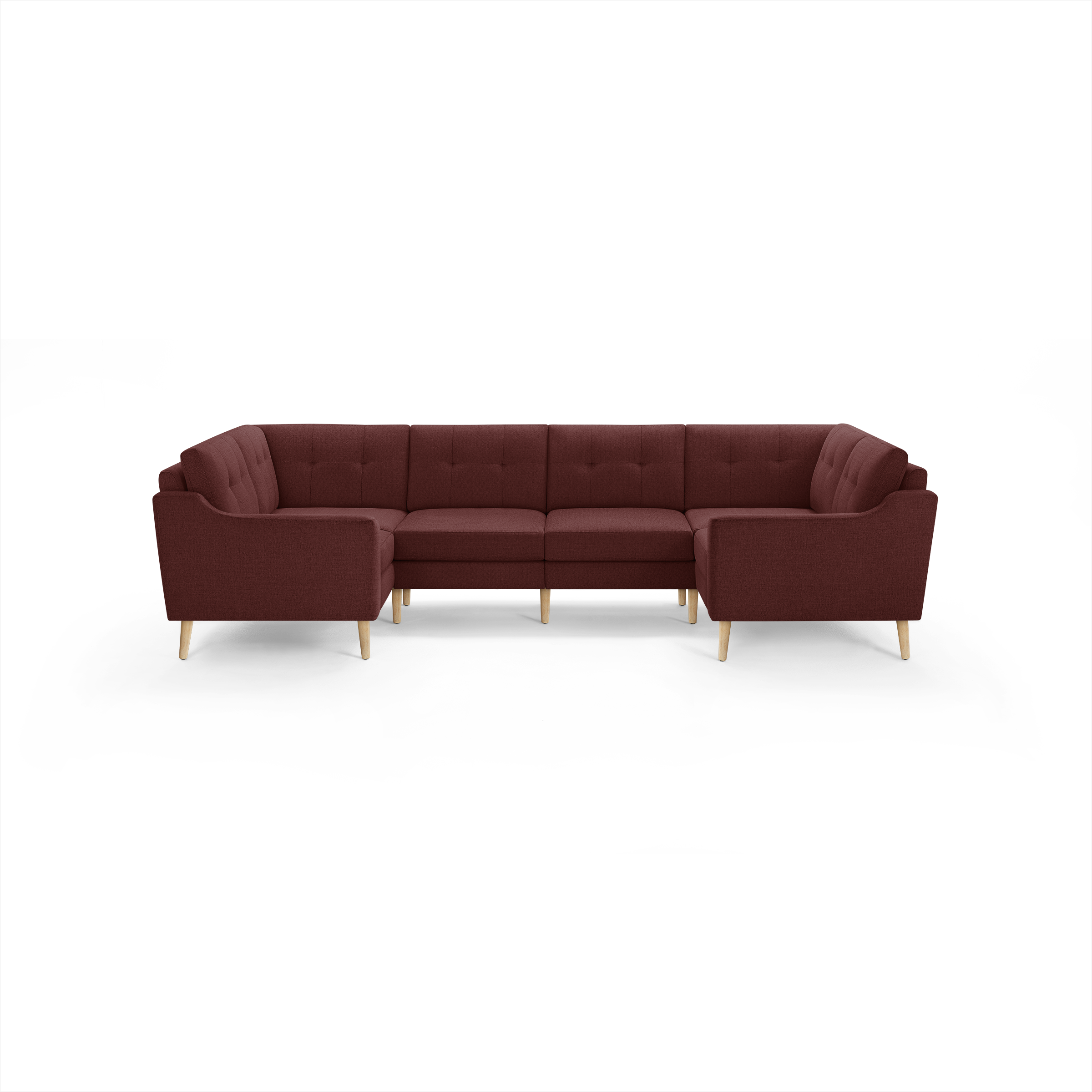 U-shaped sectional sofa in deep red fabric with tufted cushions and light wooden legs, modern and cozy design.