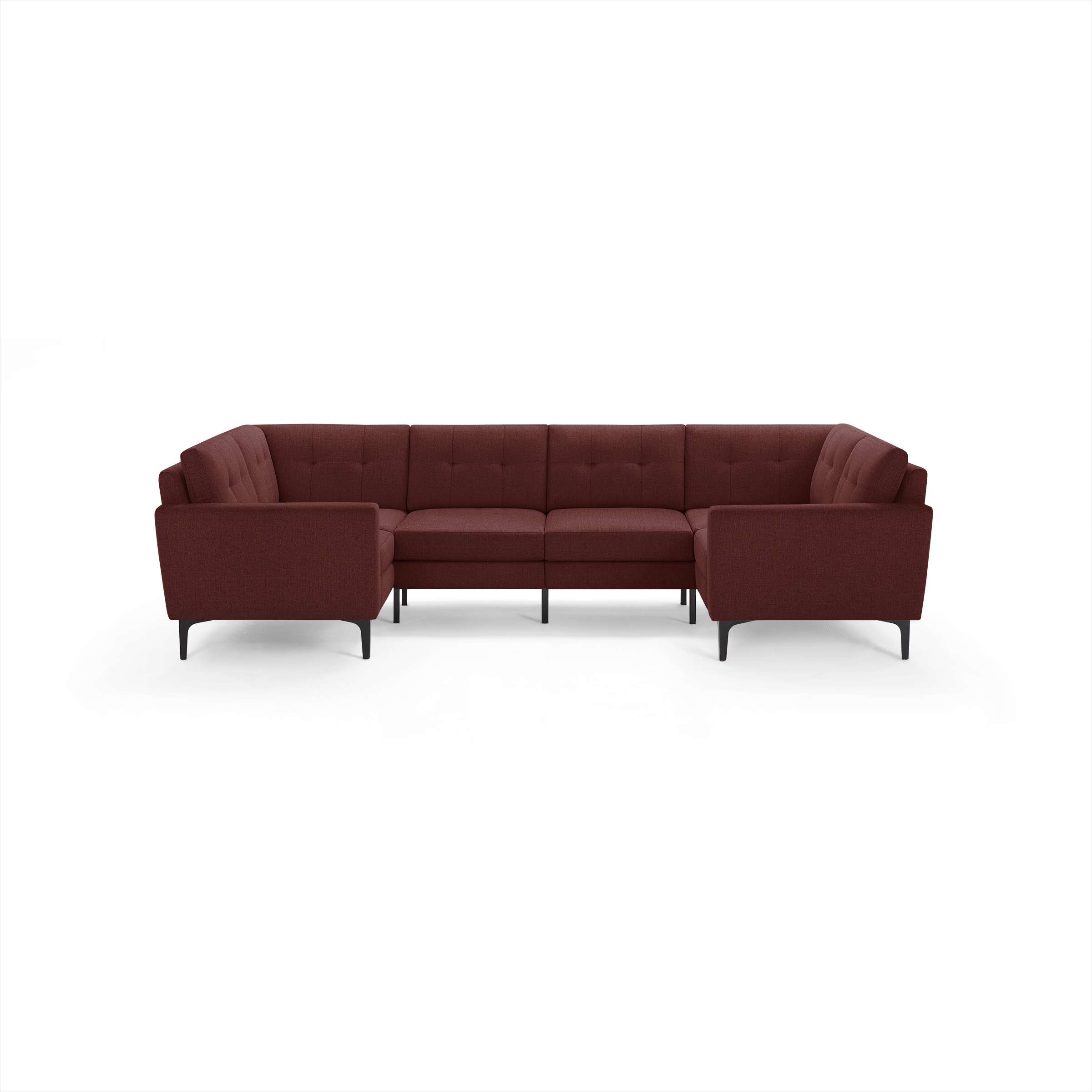 Modern U-shaped sectional sofa upholstered in deep red fabric with tufted back cushions and slim black metal legs.