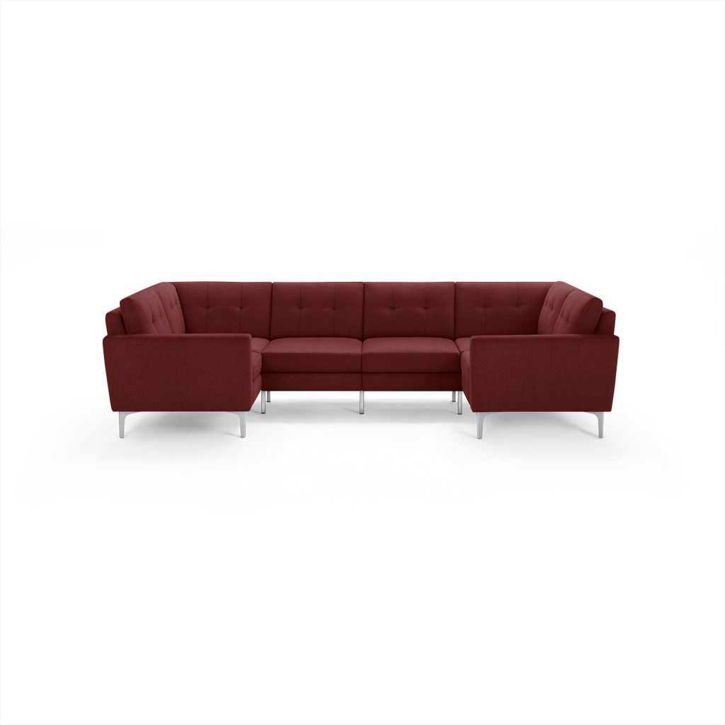 Upholstered L-shaped sectional sofa in deep burgundy with tufted back cushions and sleek metal legs, perfect for modern living rooms.