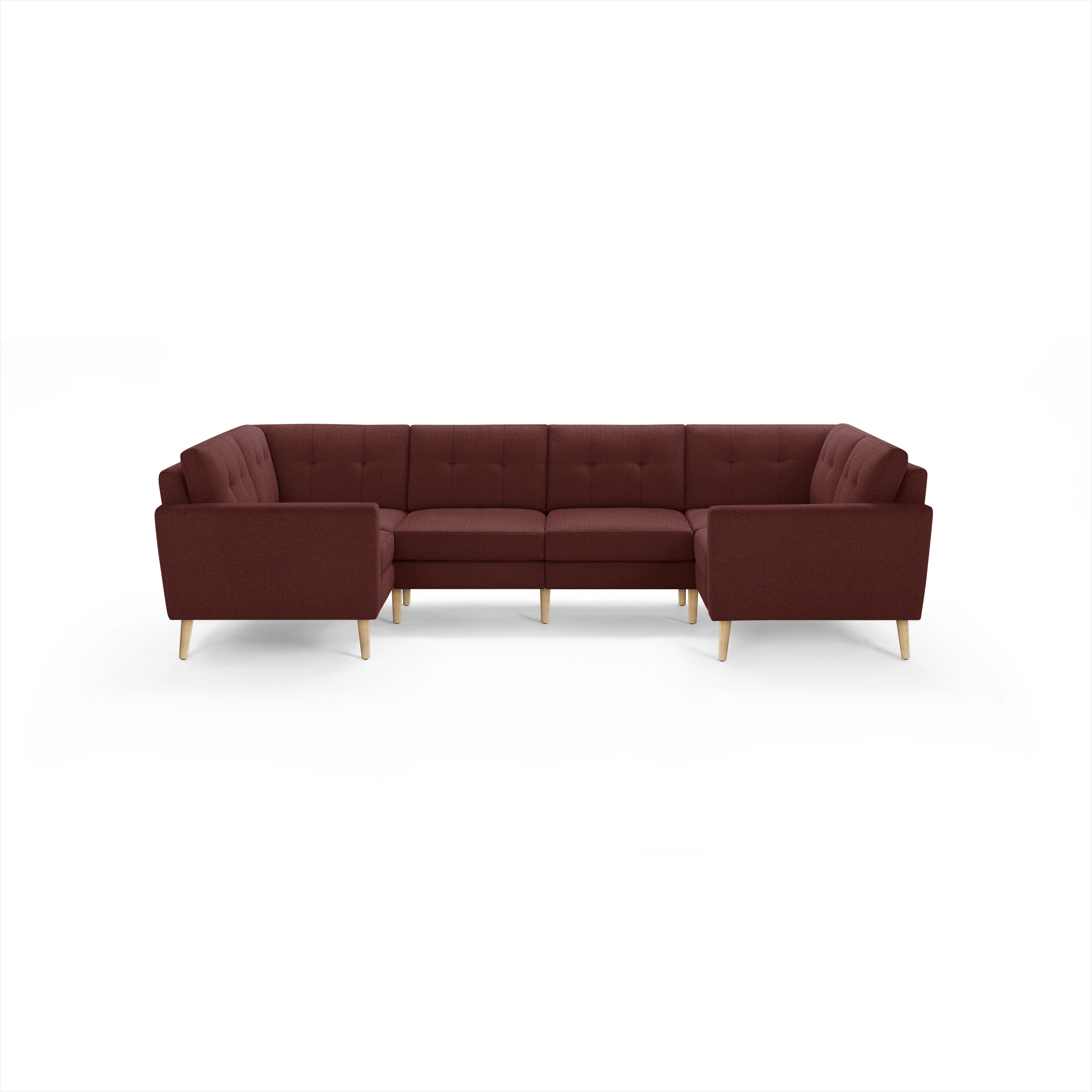 U-shaped sectional sofa in deep red fabric with tufted back cushions and light wooden legs, modern and cozy design.