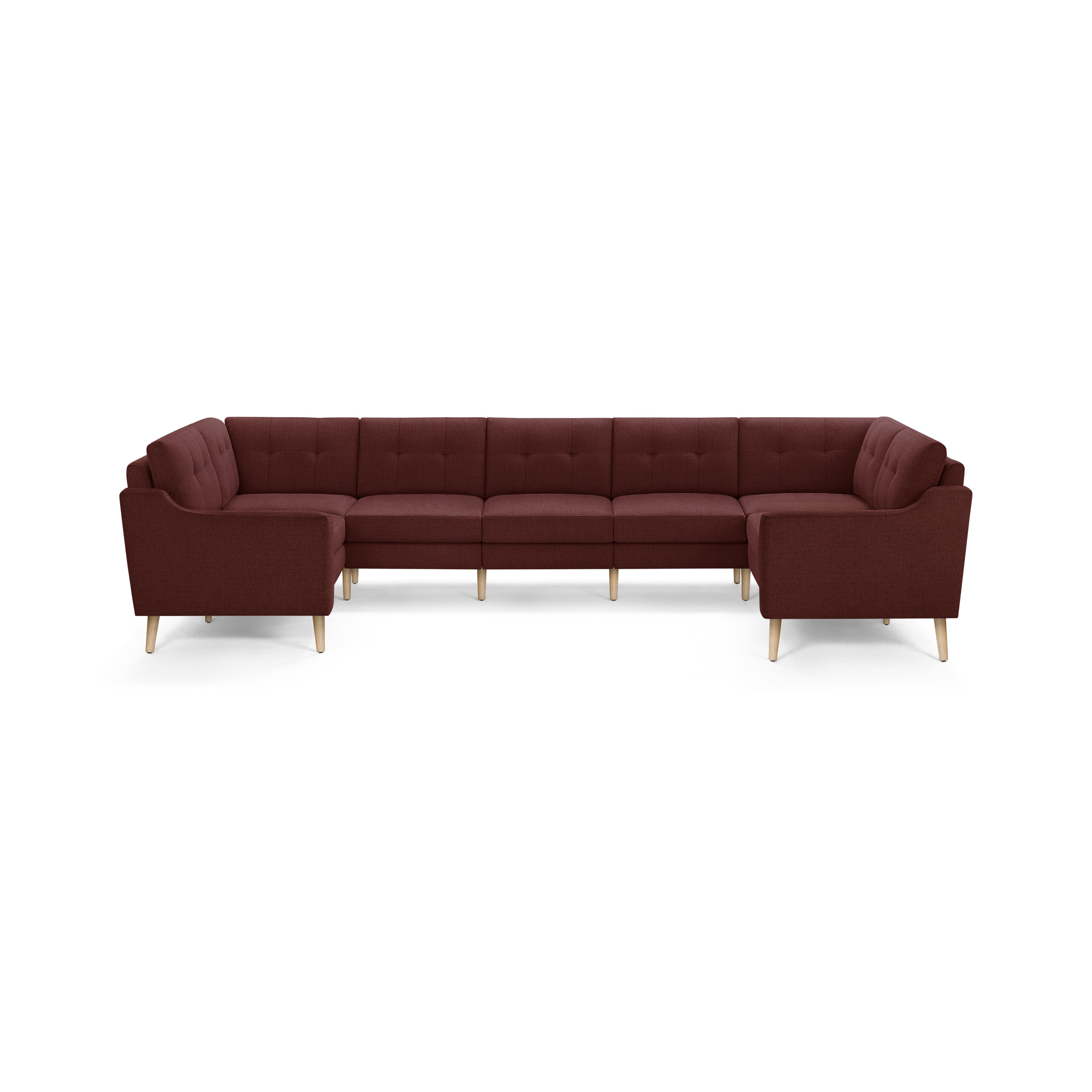 Large U-shaped sectional sofa with deep red fabric upholstery, tufted back cushions, and light wooden tapered legs.