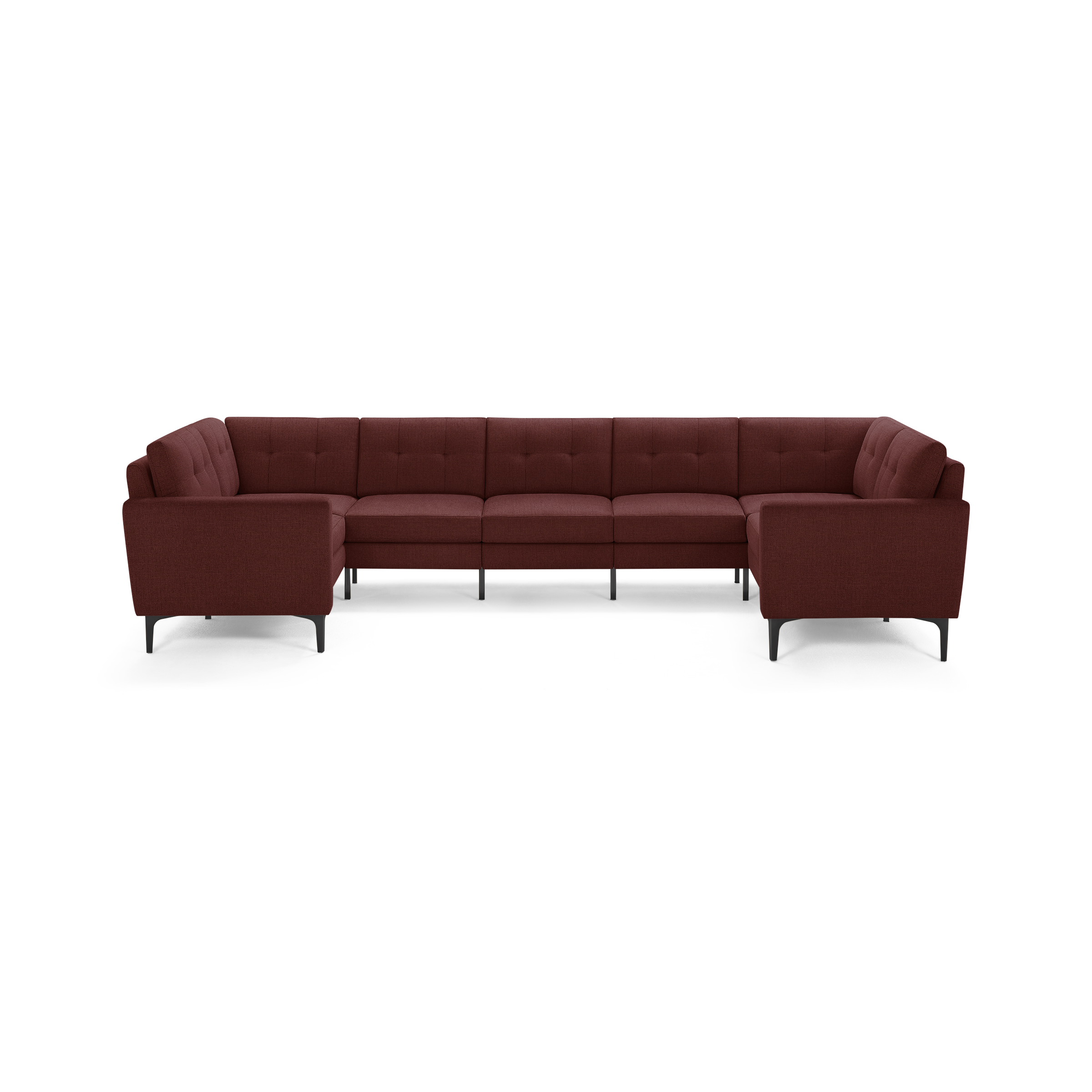 U-shaped sectional sofa in deep red fabric with tufted back cushions and slim black legs.