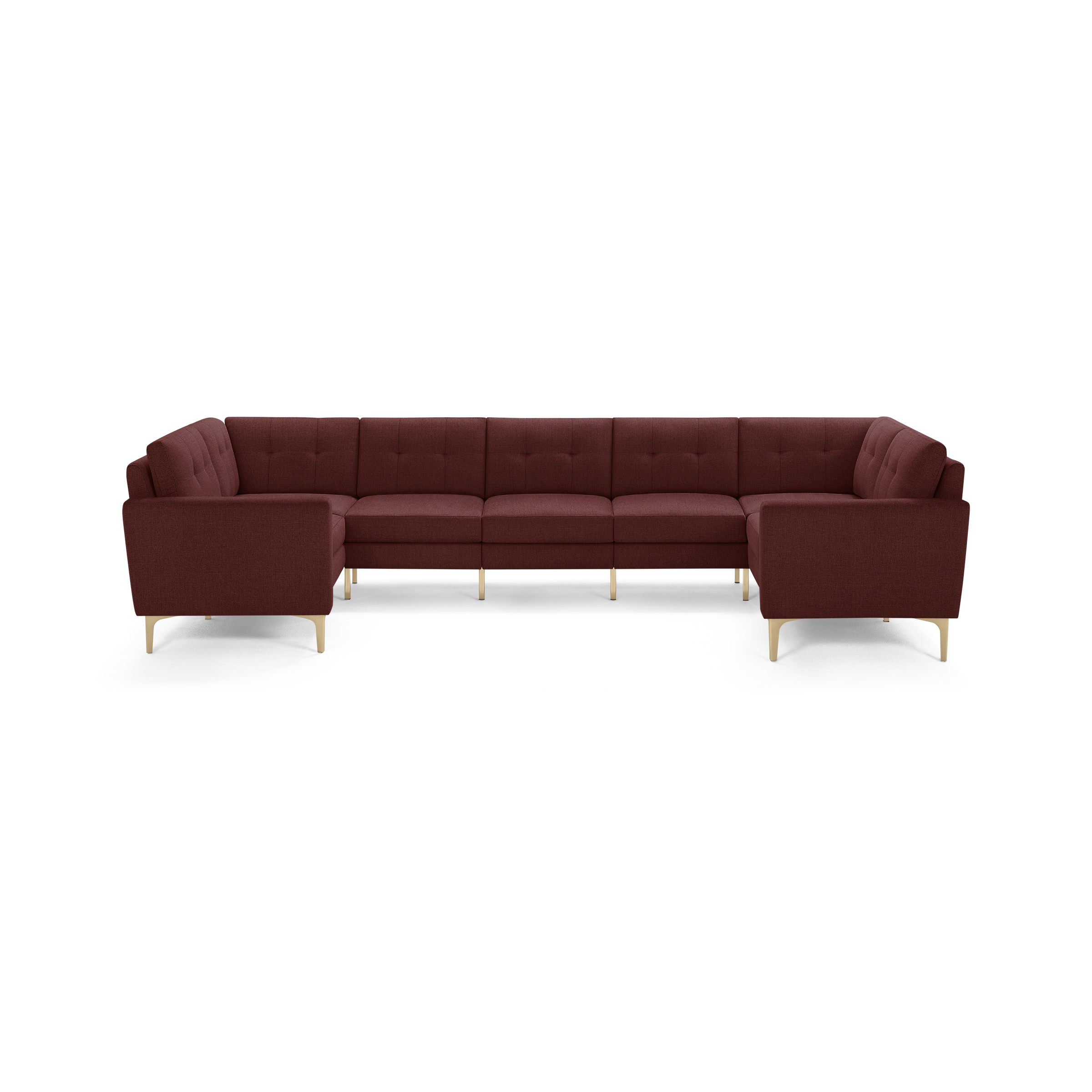 Large U-shaped sectional sofa in deep red fabric with tufted back cushions and light wooden legs, modern design.
