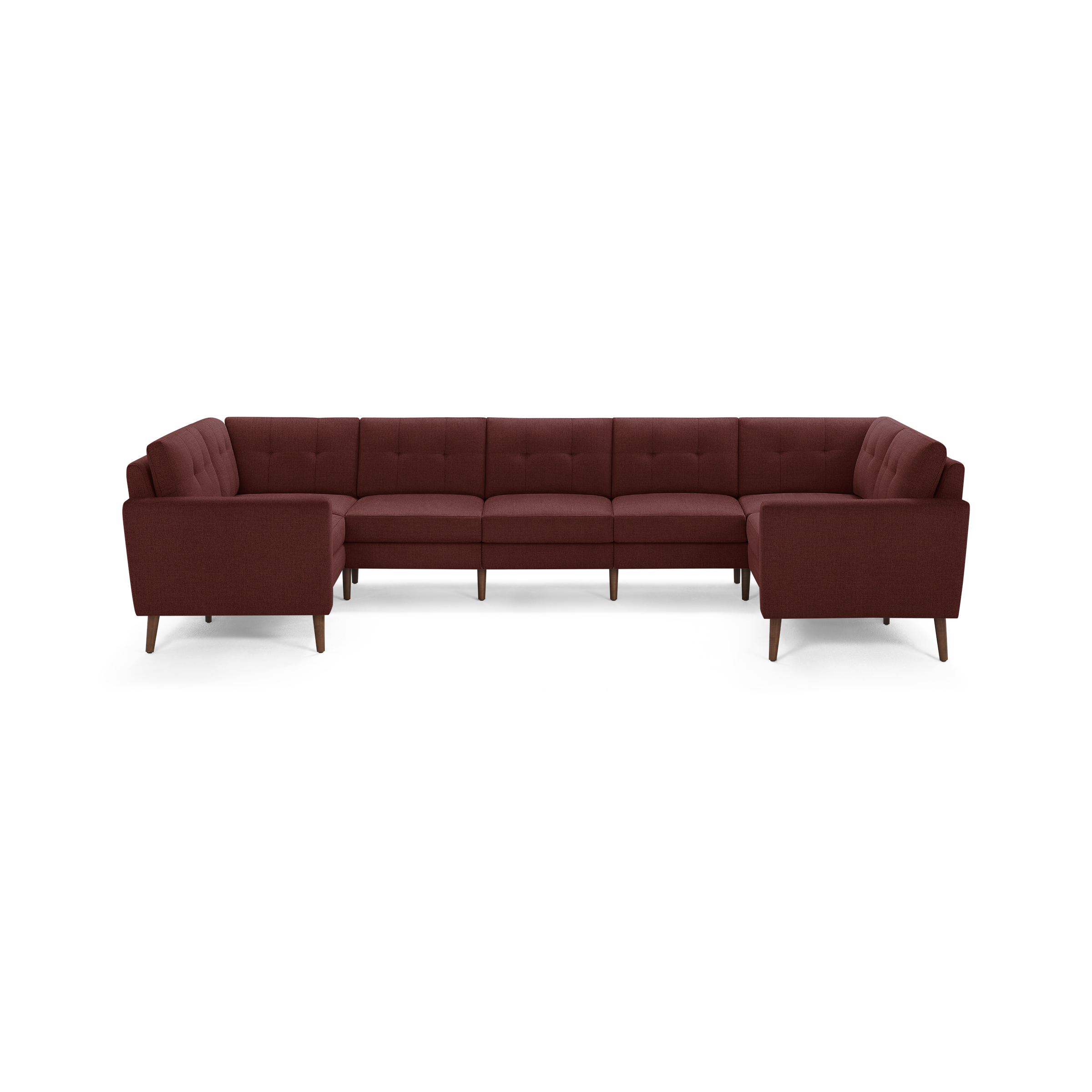 Large U-shaped sectional sofa upholstered in deep red fabric with tufted back cushions and wooden tapered legs.