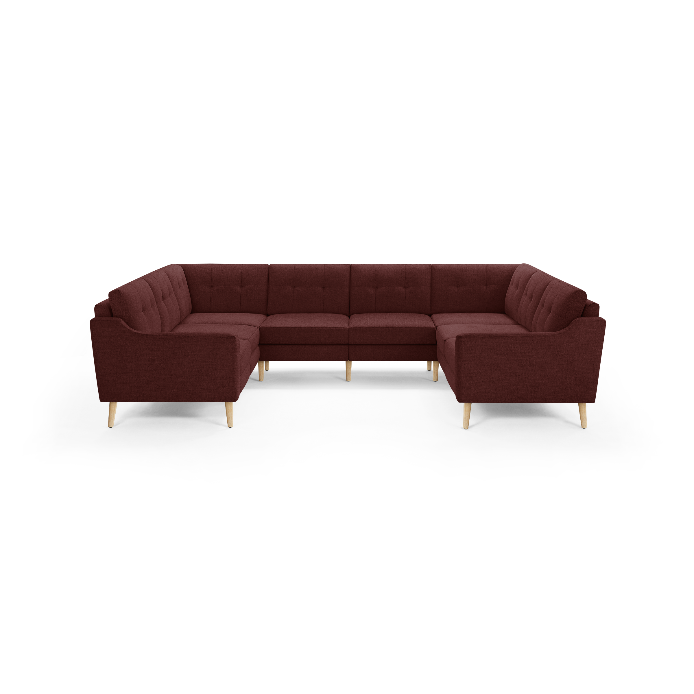 Large U-shaped sectional sofa upholstered in deep red fabric with button-tufted back cushions and light wooden legs.