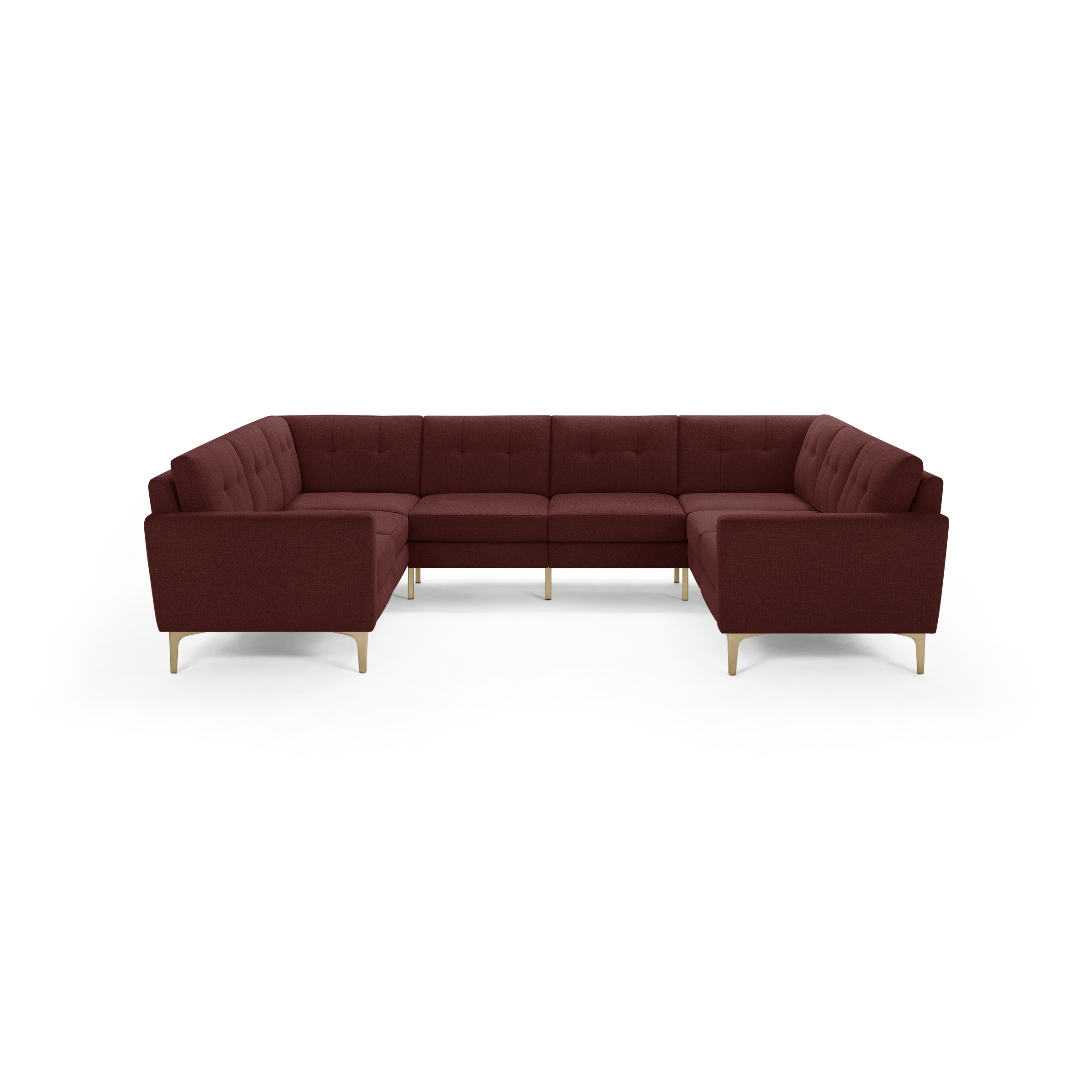 Modern U-shaped sectional sofa in deep burgundy fabric with tufted back cushions and light wooden legs.