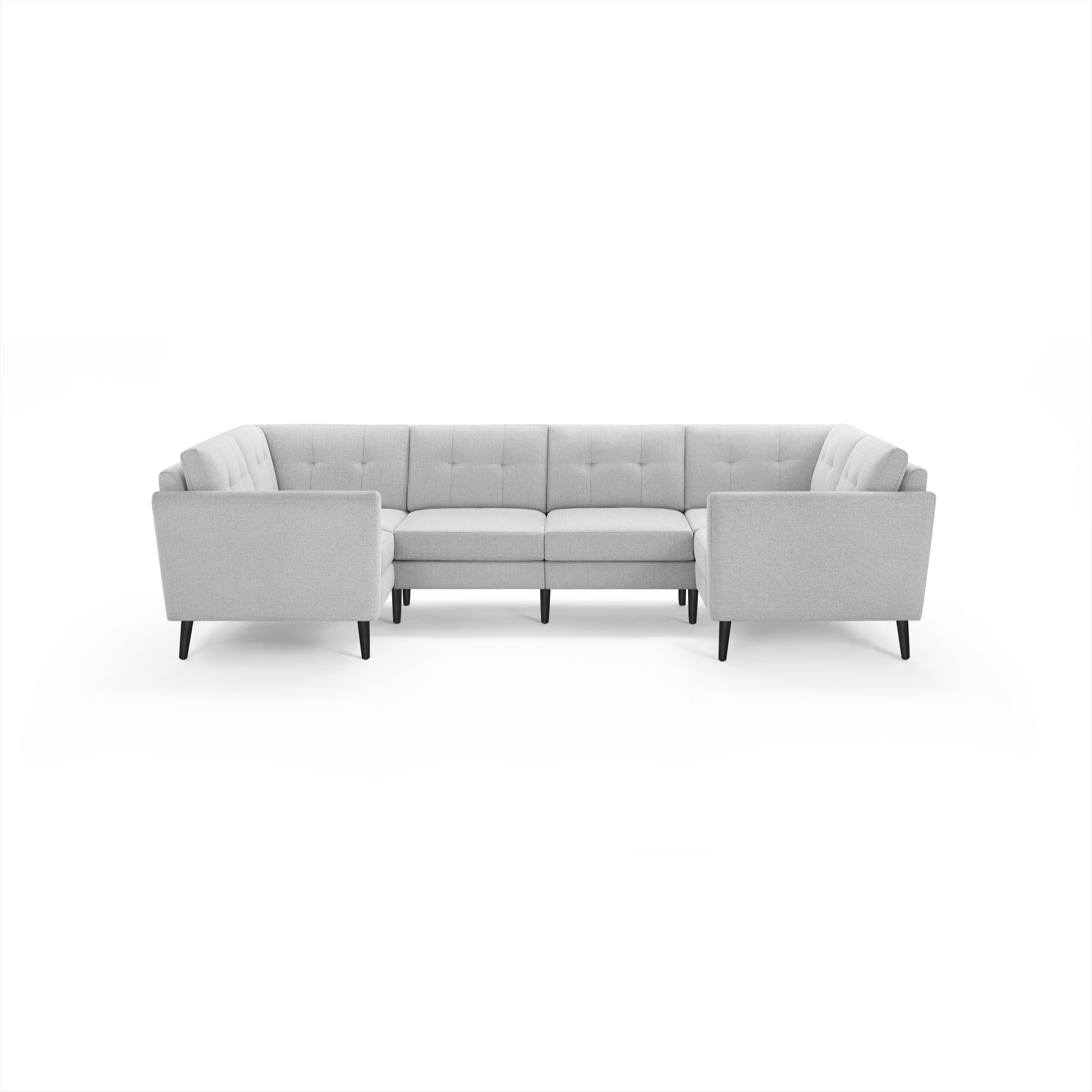 Light gray fabric sectional sofa with tufted back cushions, clean lines, and dark wooden legs.