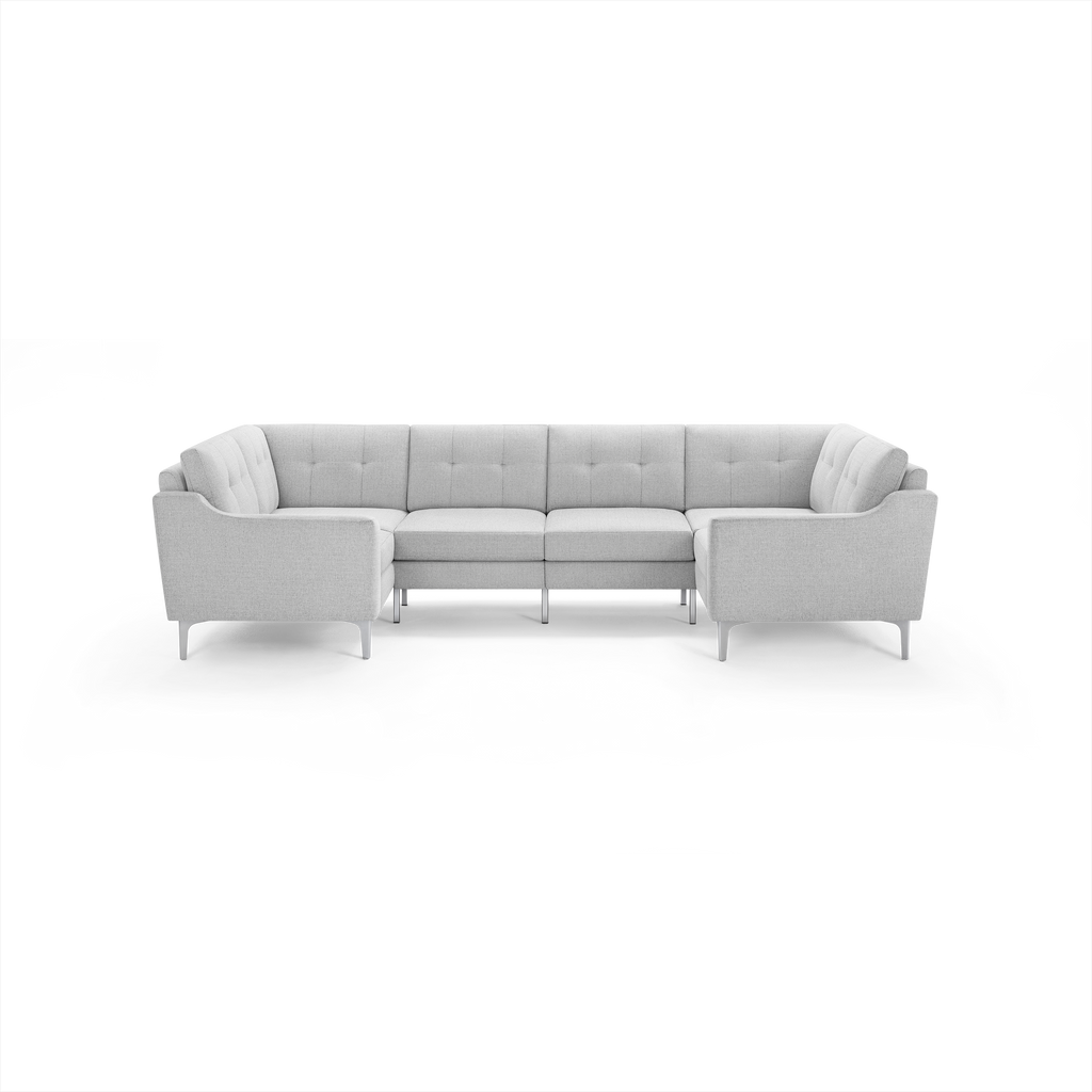 Light gray modern U-shaped sectional sofa with tufted cushions and slim metal legs, designed for spacious seating.